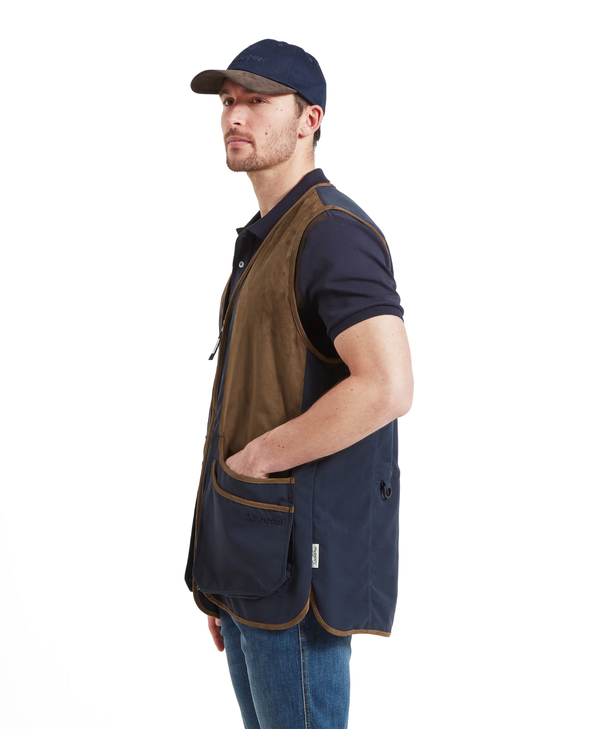 Schöffel Men's Grimsthorpe Clay Shooting Vest in Blue — three-quarter side view showing contrast suede shooting panel, open side construction, cartridge pocket with suede trim and D-ring detail