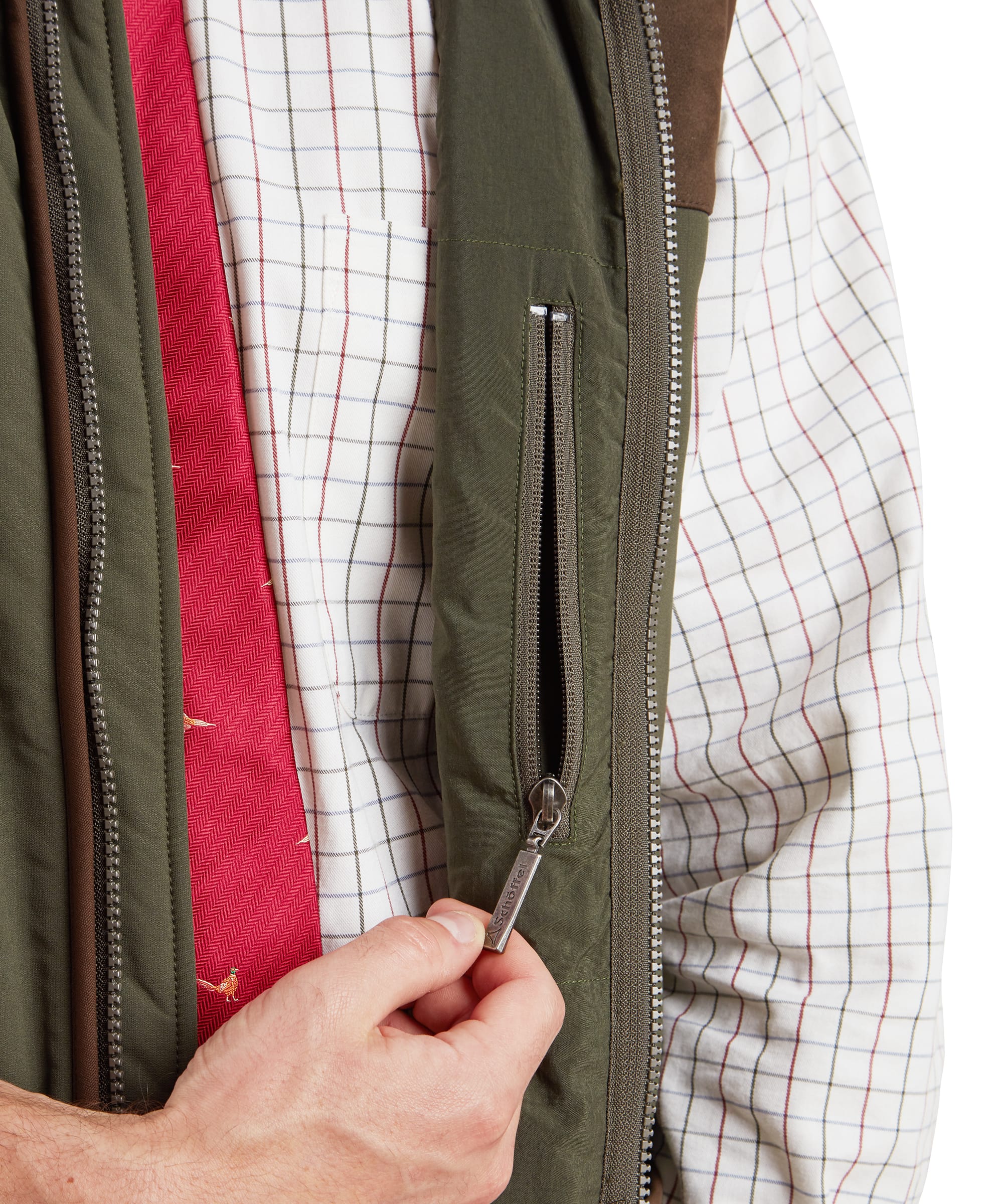 Schöffel Men's Gunby Gilet in Green — close-up of interior showing zip-secure inner pocket with Schöffel branded pull tab and lining detail