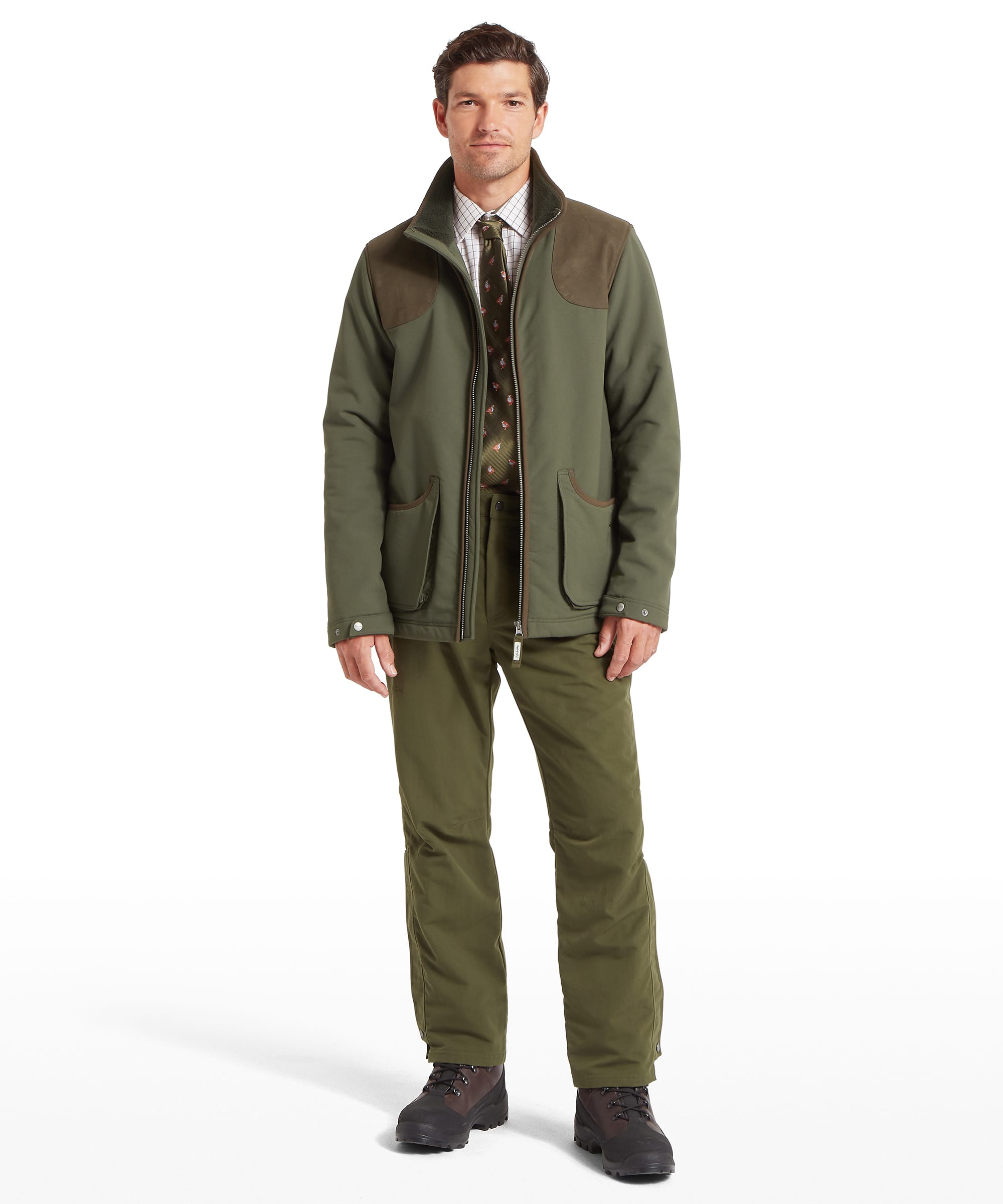 Schöffel Men's Gunby Jacket in Green — full-length front view styled with matching Schöffel technical trousers and walking boots, layered over a check shirt and tie