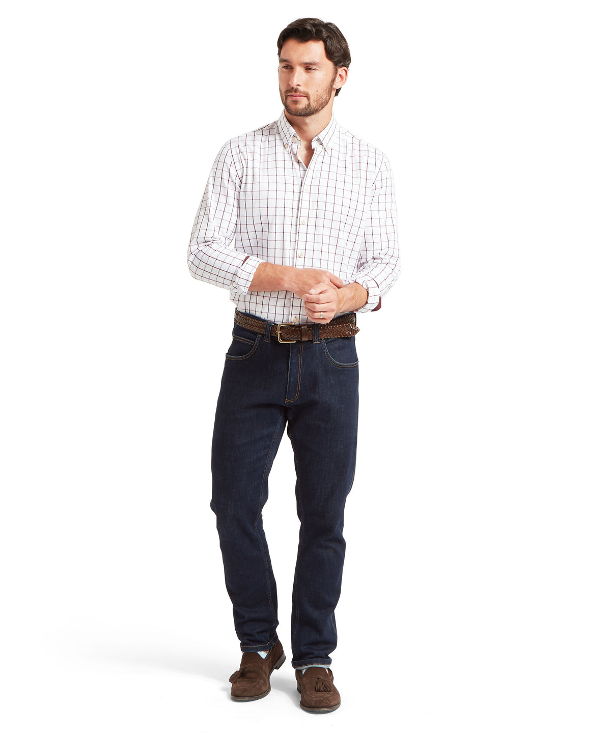 A man modeling a long-sleeve white button-down shirt with a subtle red grid pattern