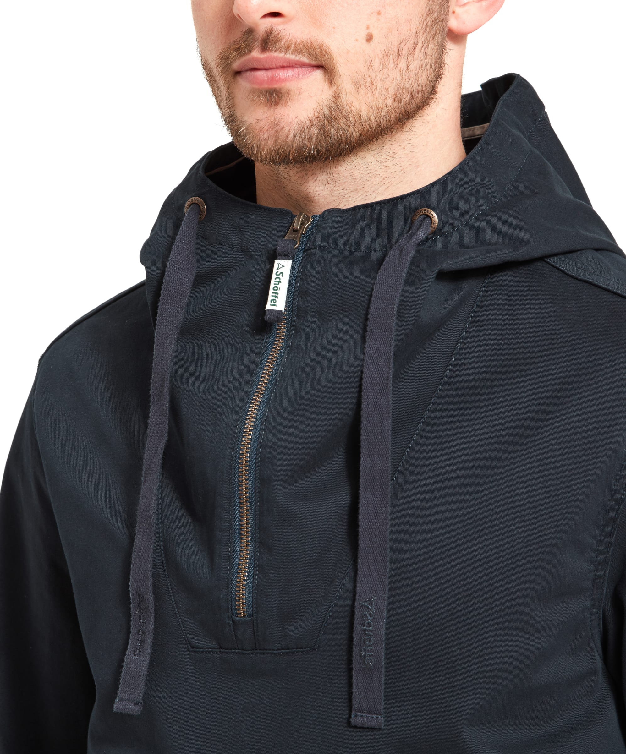 A close-up of the Schöffel Harbour Smock for Men in Navy with it's 1/4 quarter zip detail and hoode adjusting cords. The zipper pull is finished with the Schöffel logo.