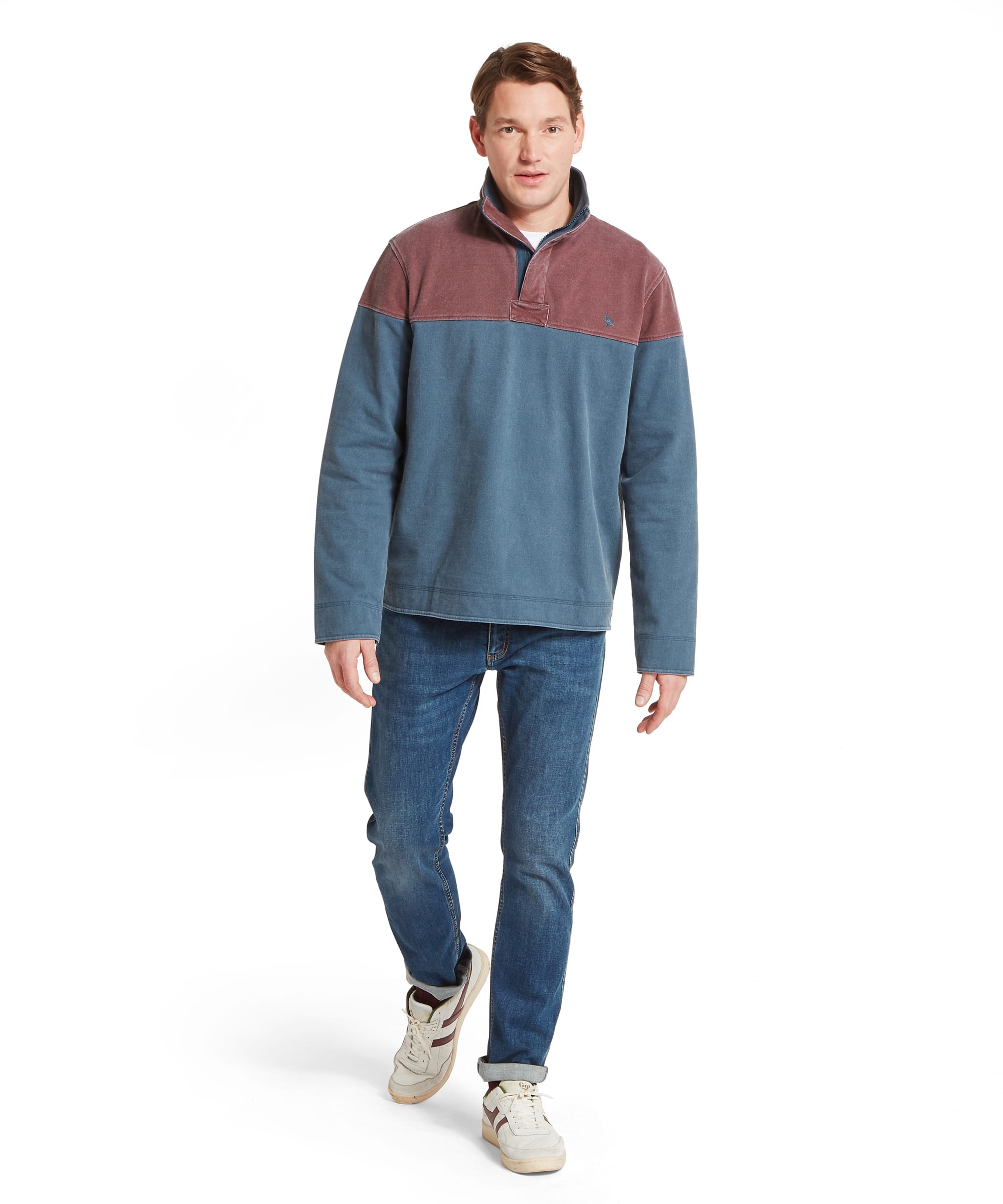 Schöffel Men's Helford Heritage Sweatshirt in red and petrol blue worn with blue jeans and white trainers, full length front view showing relaxed country casual fit