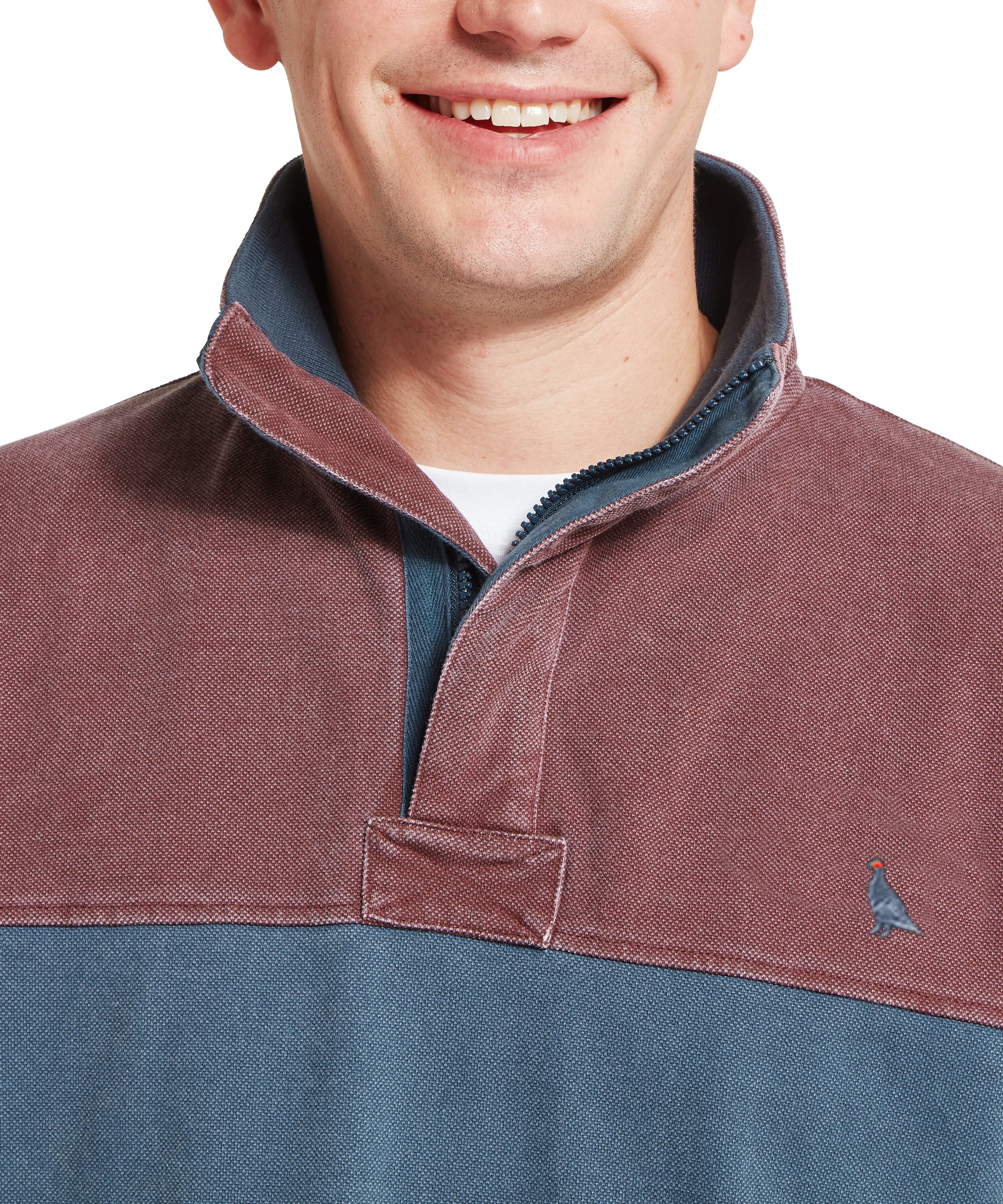 Close-up of back neck detail on Schöffel Men's Helford Heritage Sweatshirt showing red pigment-dyed heavy cotton fabric texture and petrol blue Schöffel embroidered branding