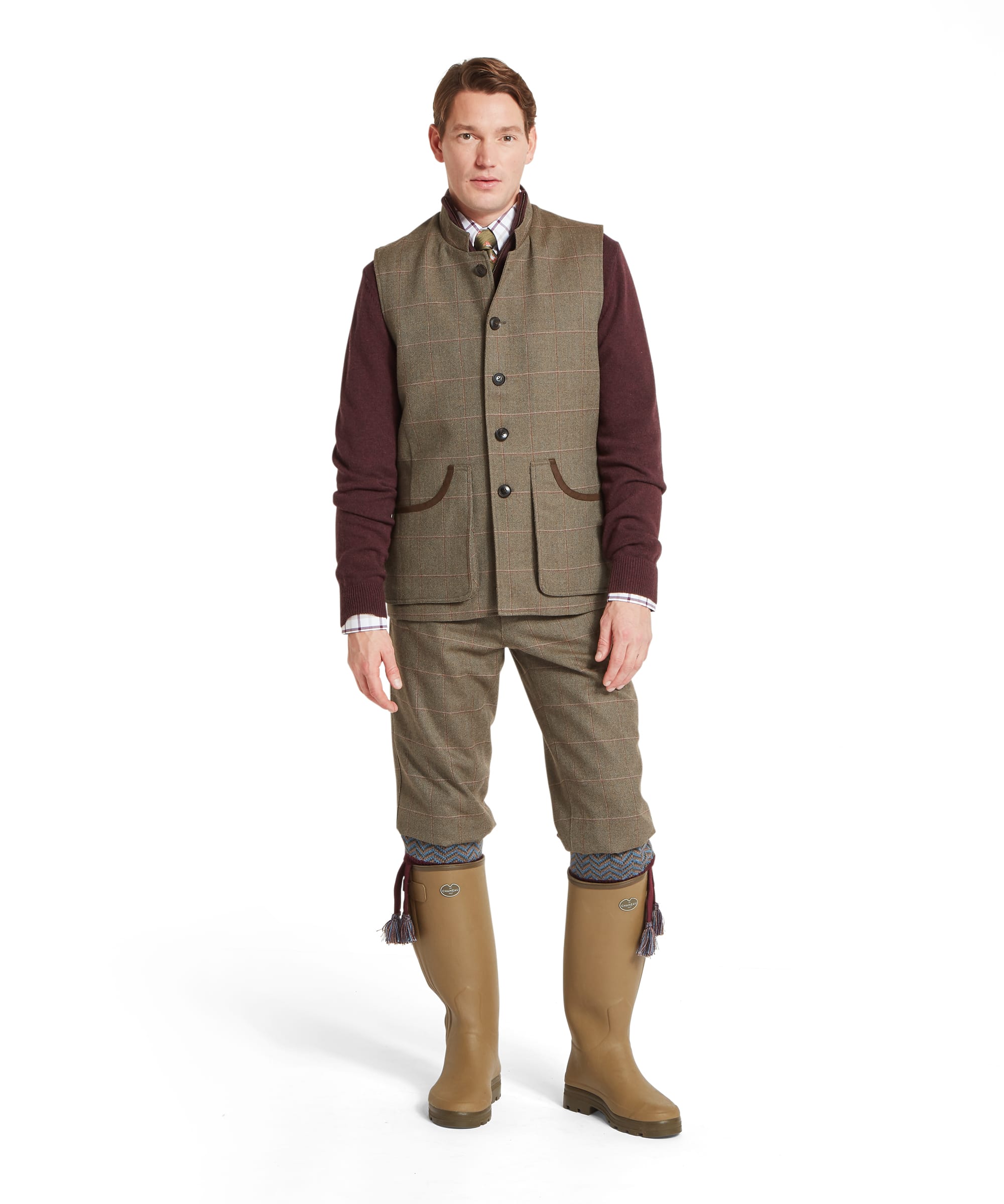 Schöffel Men's Holcot Tweed Waistcoat in Lochlane Tweed worn with matching tweed plus-twos and rubber shooting boots, full length country sporting outfit