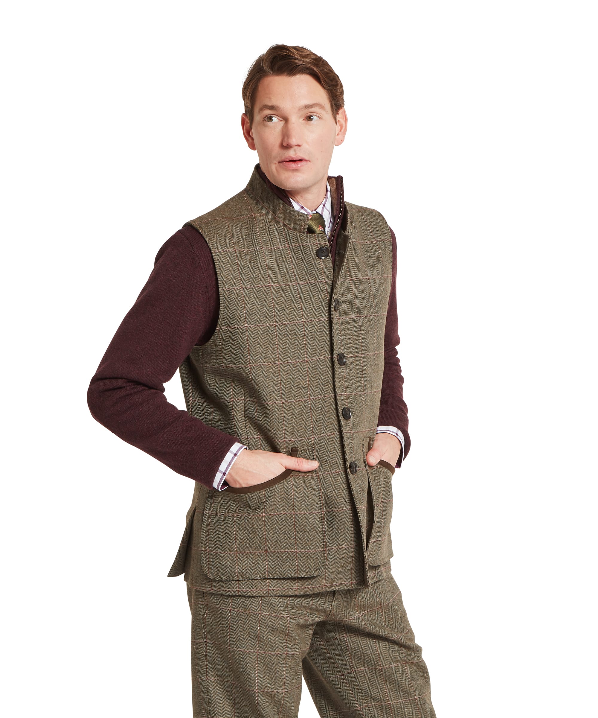 Schöffel Men's Holcot Tweed Waistcoat in Lochlane Tweed, three-quarter view showing button front, suede-trimmed patch pockets and stand collar with hands in pockets