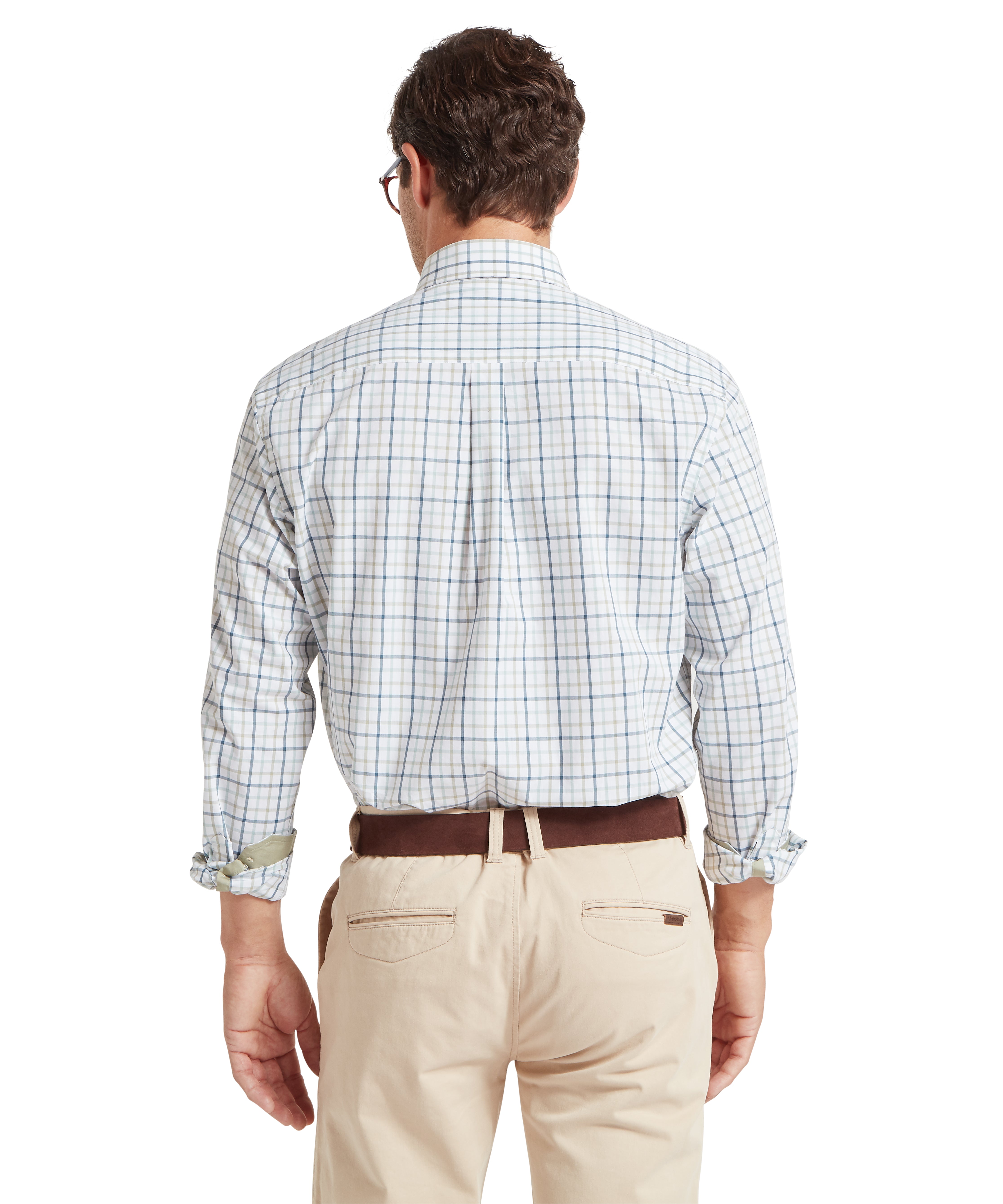 Man wearing a checkered shirt and beige pants on a white background