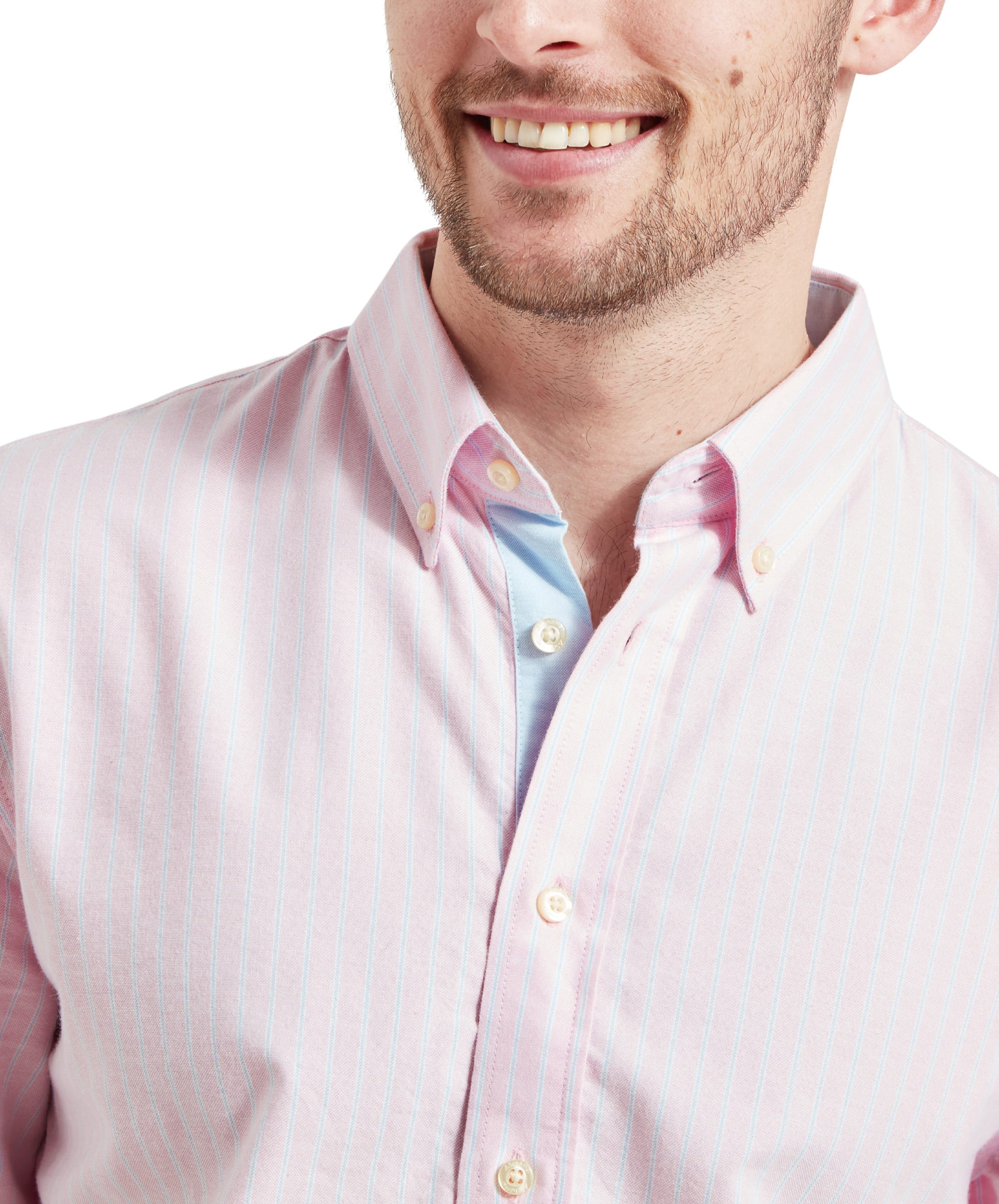 Close-up of the collar on the Schöffel Holt Soft Oxford Tailored Shirt for Men in Pink Stripe, highlighting the button down design, the blue button placket and the pinstripe in pale blue against the pink.