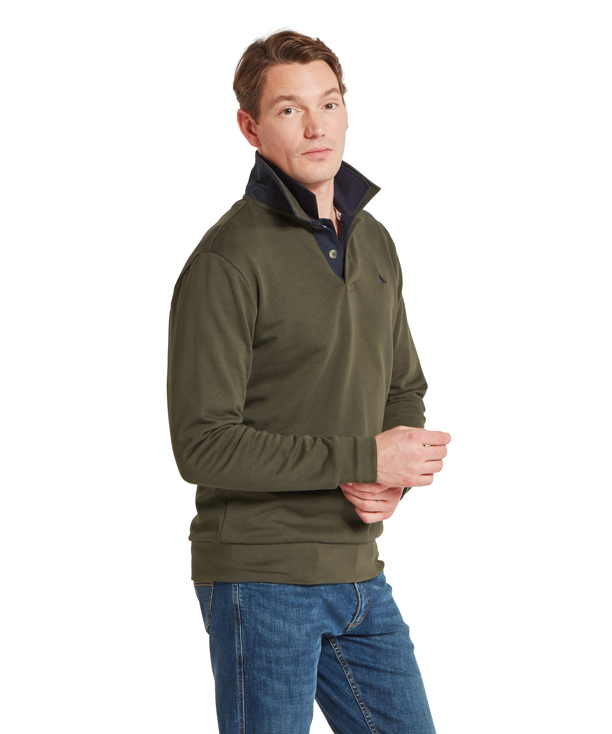 Schöffel Men's Horseley Rugby Sweatshirt in green, three-quarter view showing contrast navy collar, Schöffel pheasant chest logo and elbow patch detail worn with blue jeans