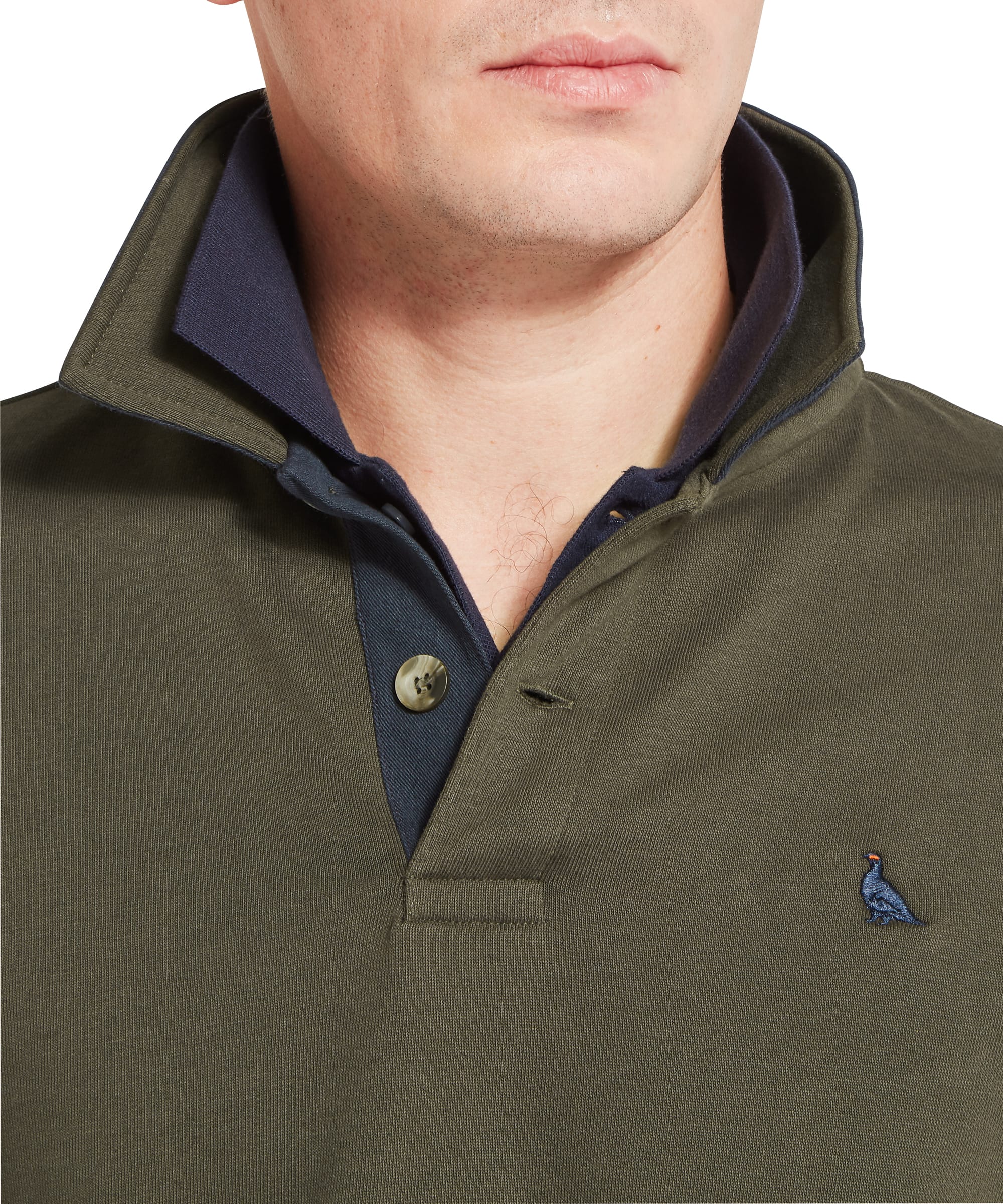 Close-up of Schöffel Men's Horseley Rugby Sweatshirt in green showing contrast navy rugby collar, single horn button fastening and embroidered pheasant logo on chest