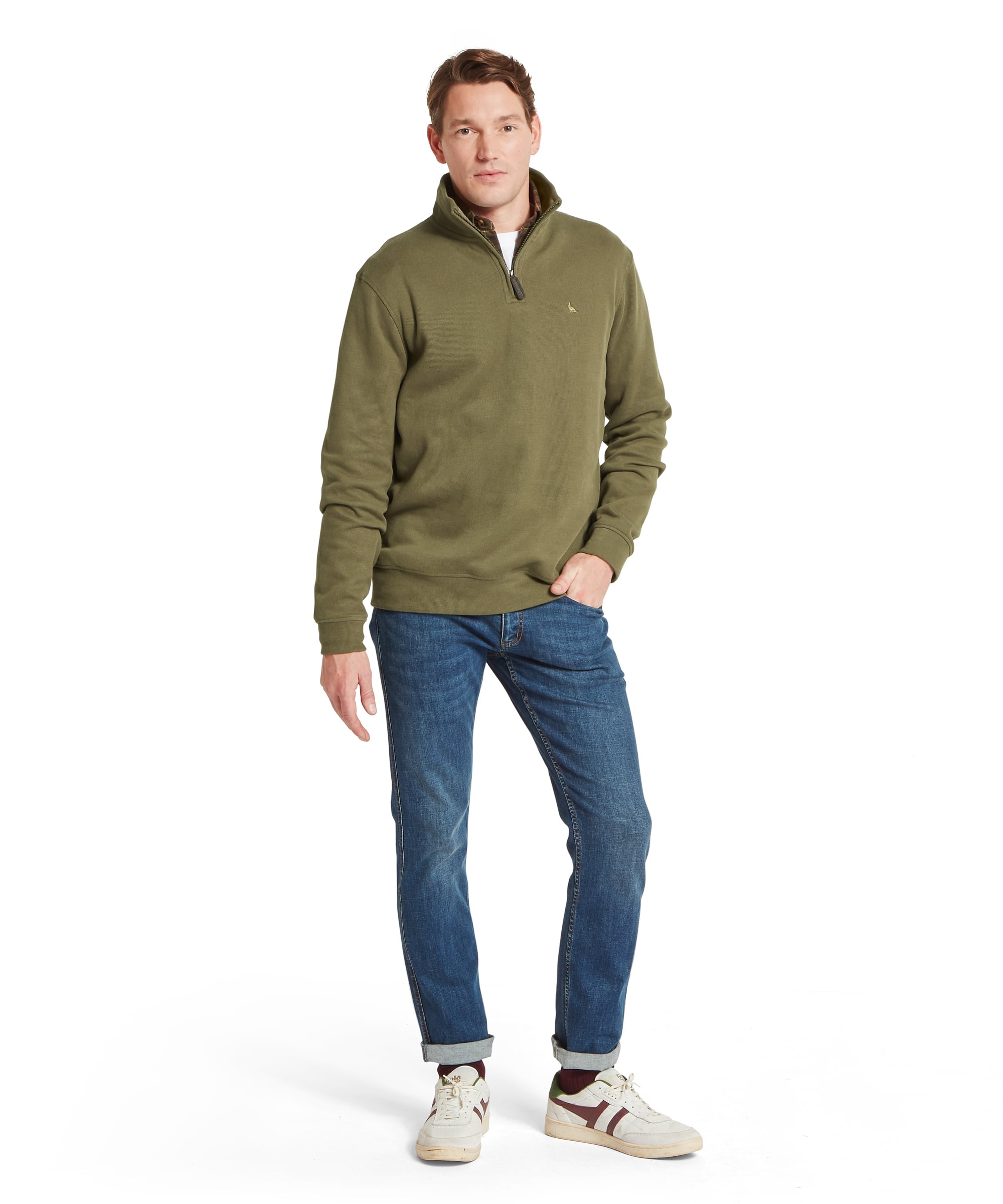 Schöffel Men's Kingsand Quarter-Zip Jumper in olive green worn with blue jeans and white trainers, full length front view showing quarter-zip neck, pheasant chest logo and relaxed fit