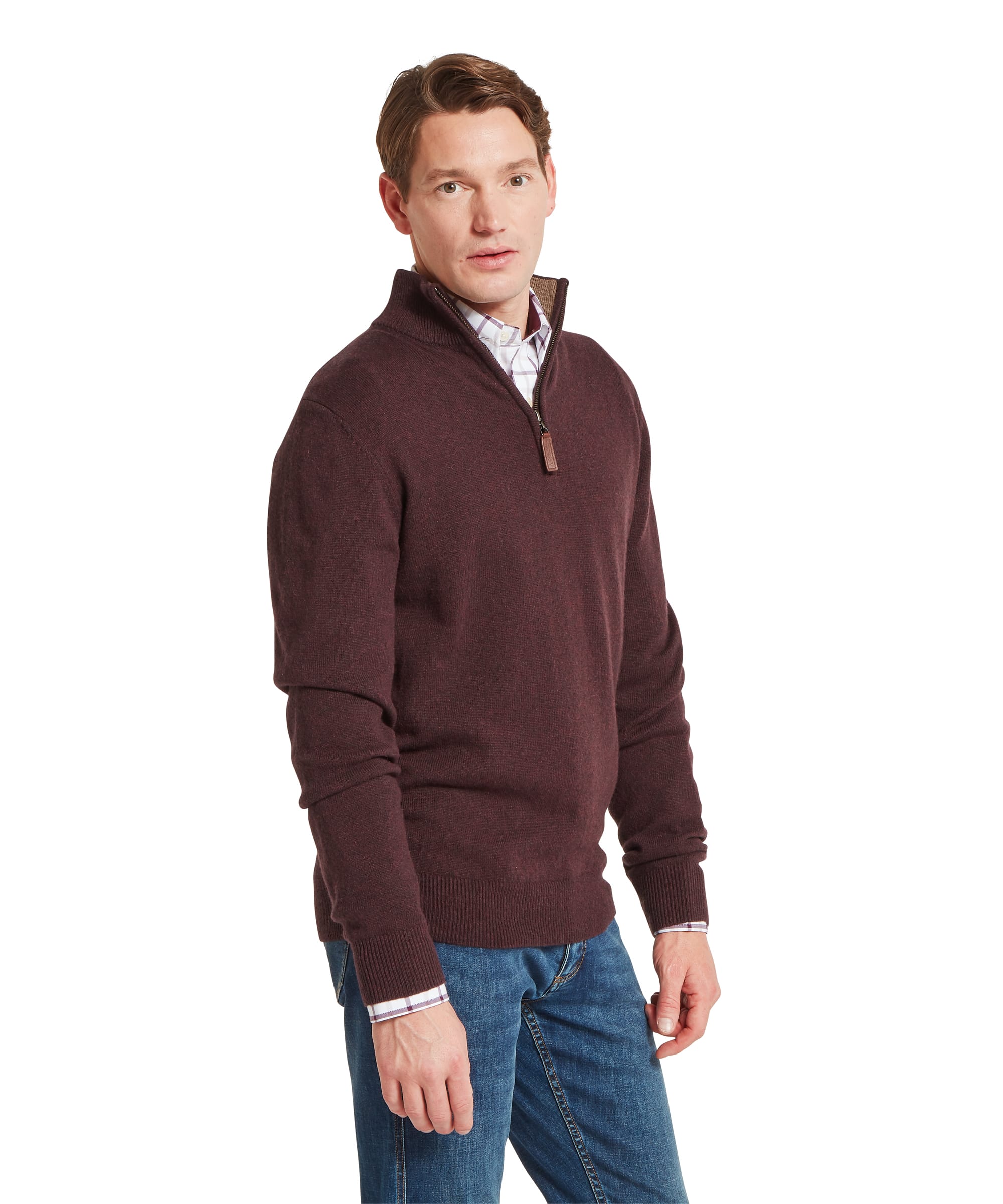 Schoffel Mens Lewis Lambswool Quarter-Zip Jumper in burgundy, three-quarter side view showing quarter-zip neck with leather zip pull and fine lambswool knit, worn with blue jeans