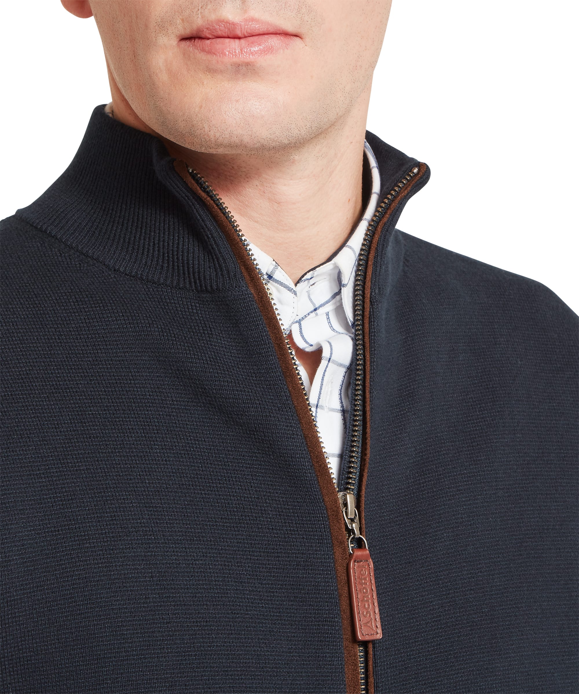 Close-up of Schoffel Mens Marlow Full-Zip Jumper in navy showing full-length zip construction with contrast tan leather trim and Schoffel branded leather zip pull, layered over a windowpane check shirt