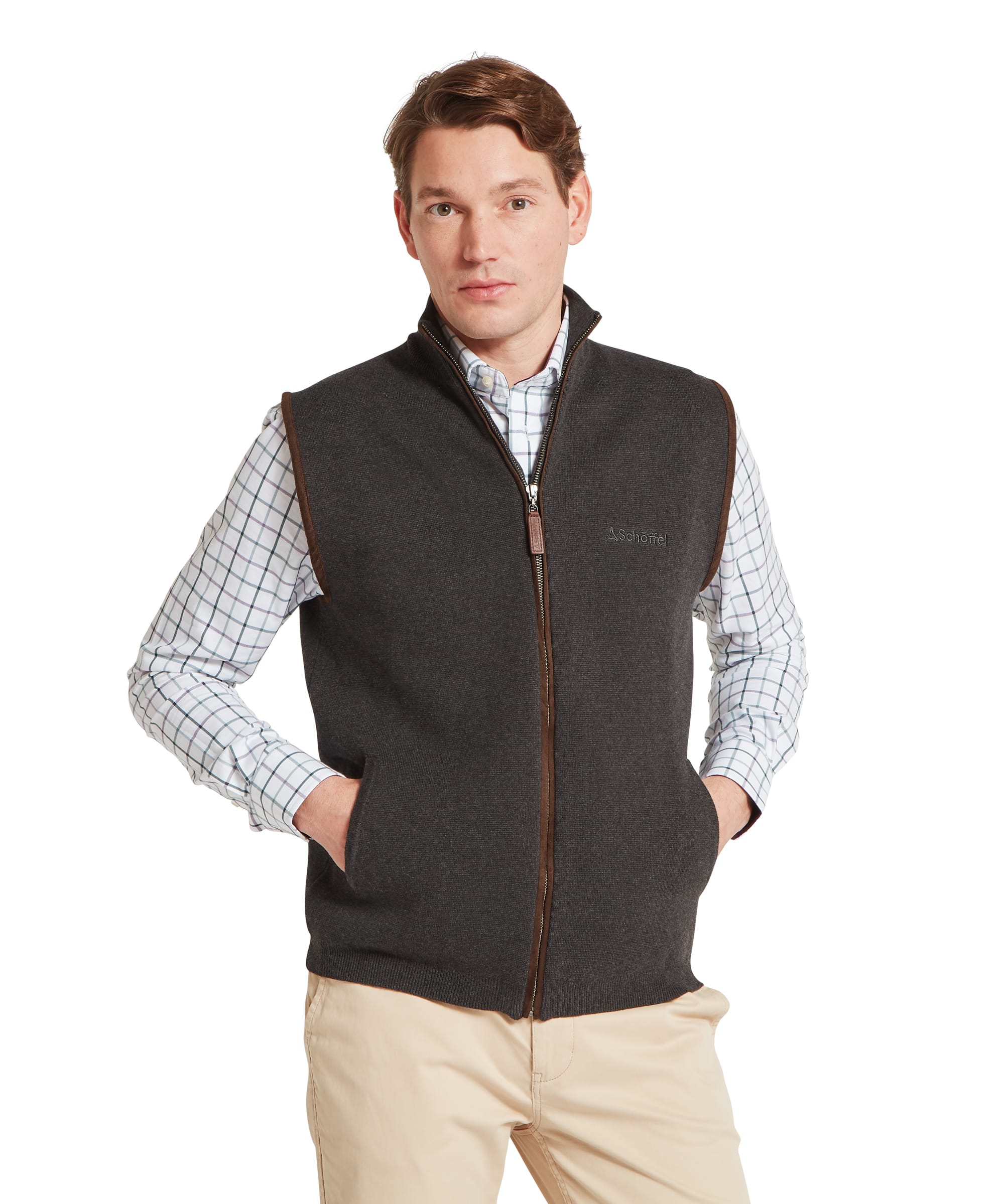 Schoffel Mens Marlow Gilet in charcoal, front view showing full-length zip with contrast tan leather zip pull and trim, Schoffel chest logo embroidery and side pockets, worn over a check shirt