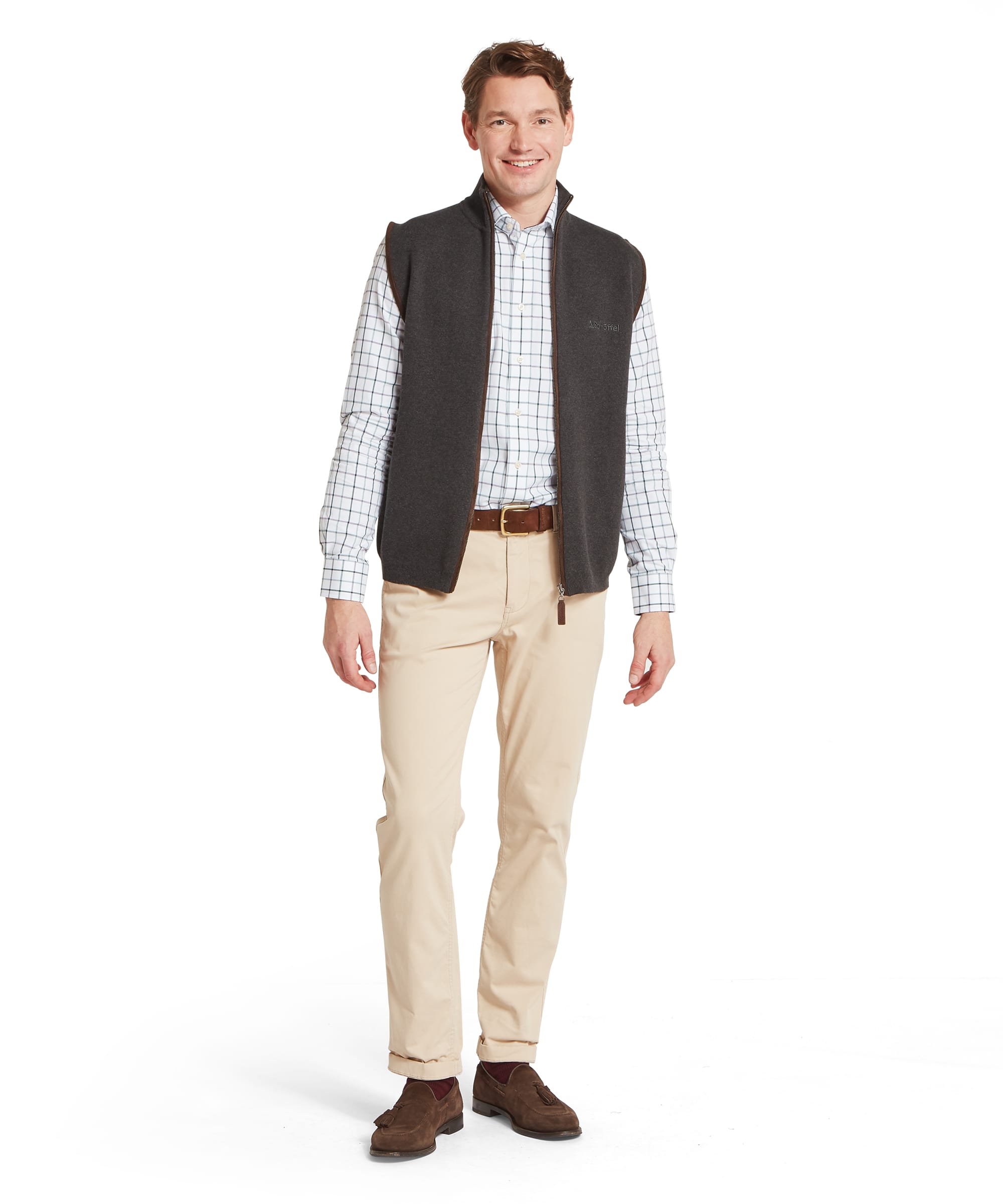 Schoffel Mens Marlow Gilet in charcoal worn with stone chinos, check shirt and brown suede loafers, full length front view showing smart country layering outfit