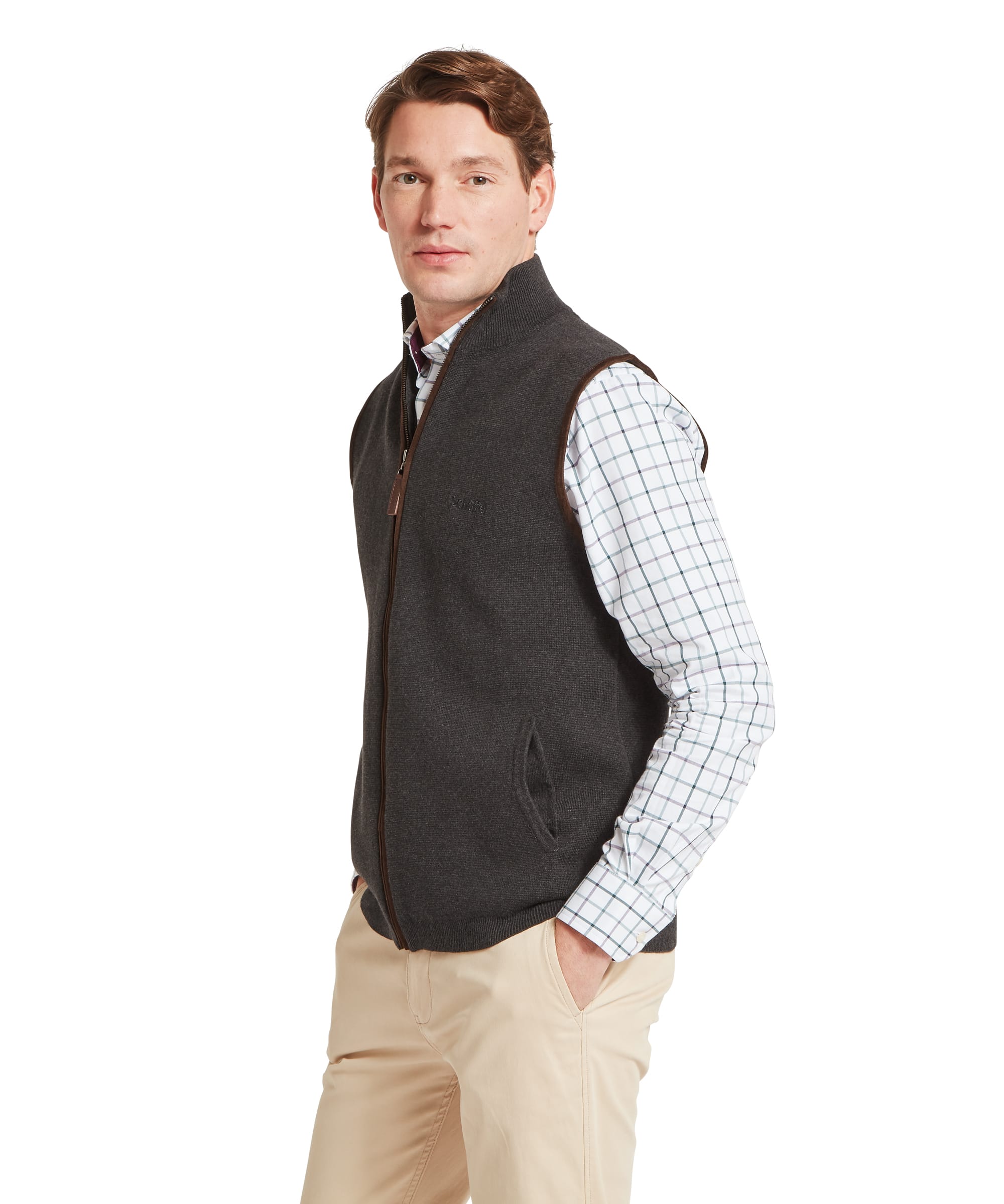 Schoffel Mens Marlow Gilet in charcoal, three-quarter view showing full-length zip with contrast tan leather trim, Schoffel chest logo and side pocket detail, layered over a check shirt