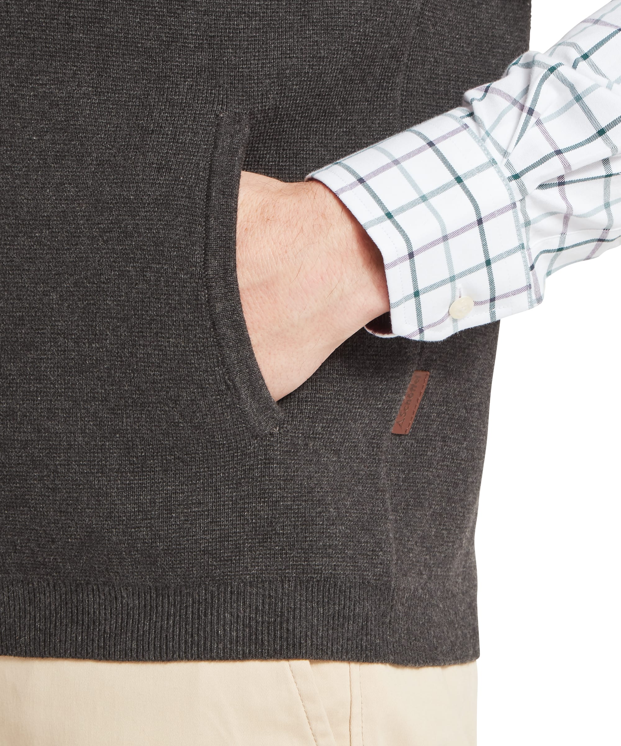 Close-up detail of Schoffel Mens Marlow Gilet side pocket in charcoal showing neat welt pocket opening, ribbed hem and Schoffel woven leather label tab