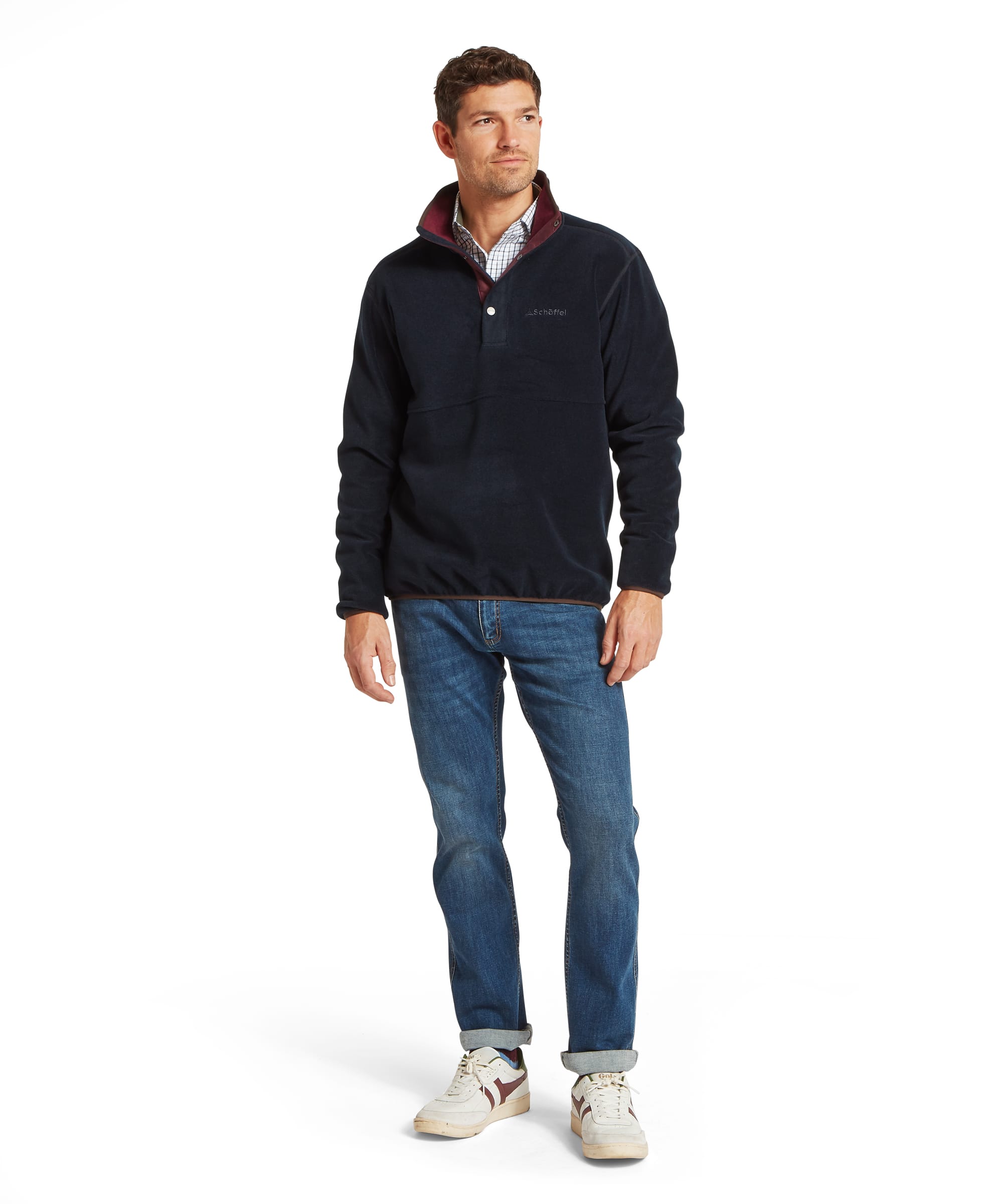 Schoffel Mens Norton Fleece in navy worn with blue jeans and white trainers, full length front view showing snap-button neck, Schoffel logo and relaxed country casual outfit