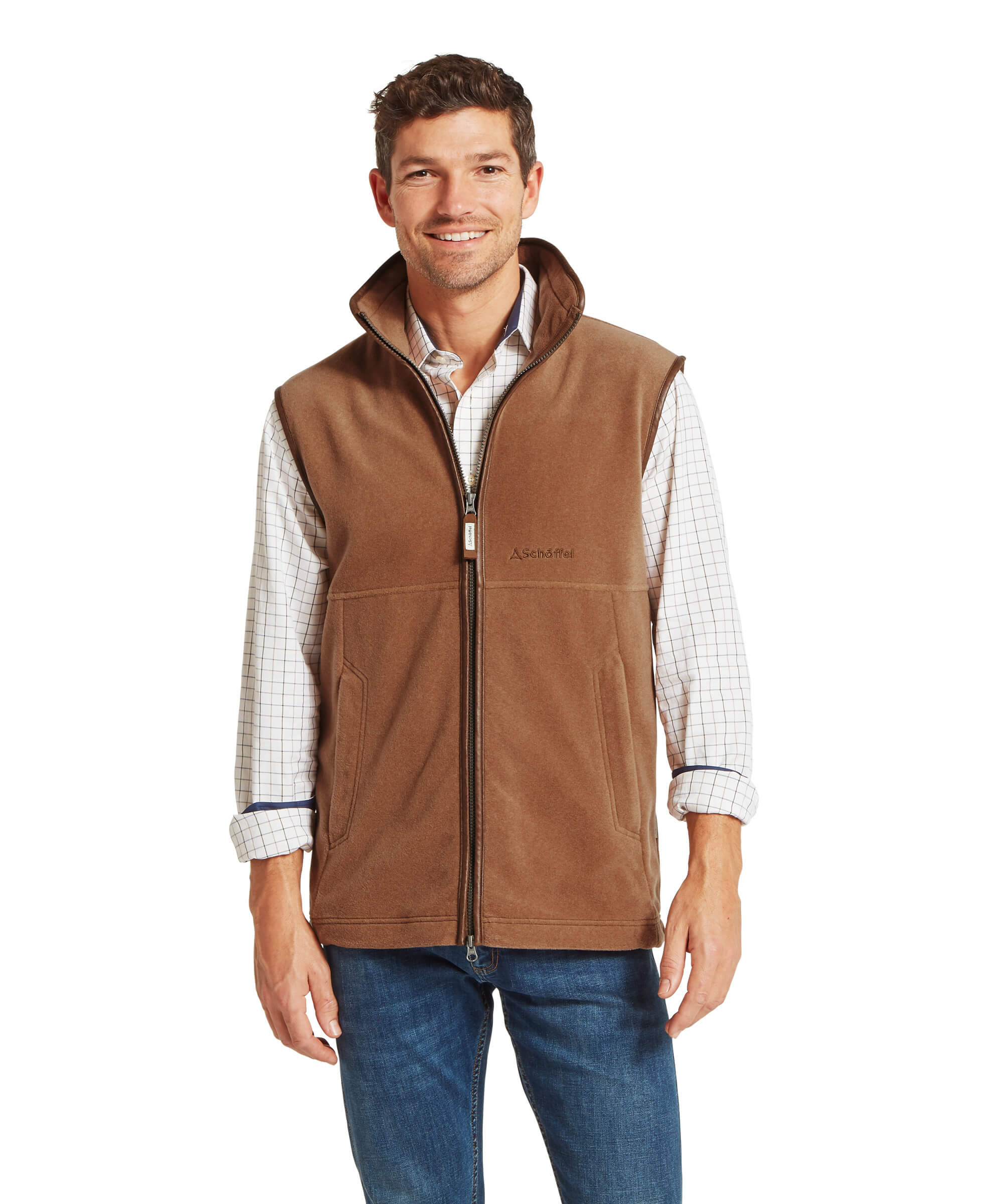 Man wearing a brown fleece gilet over a plaid shirt on a white background