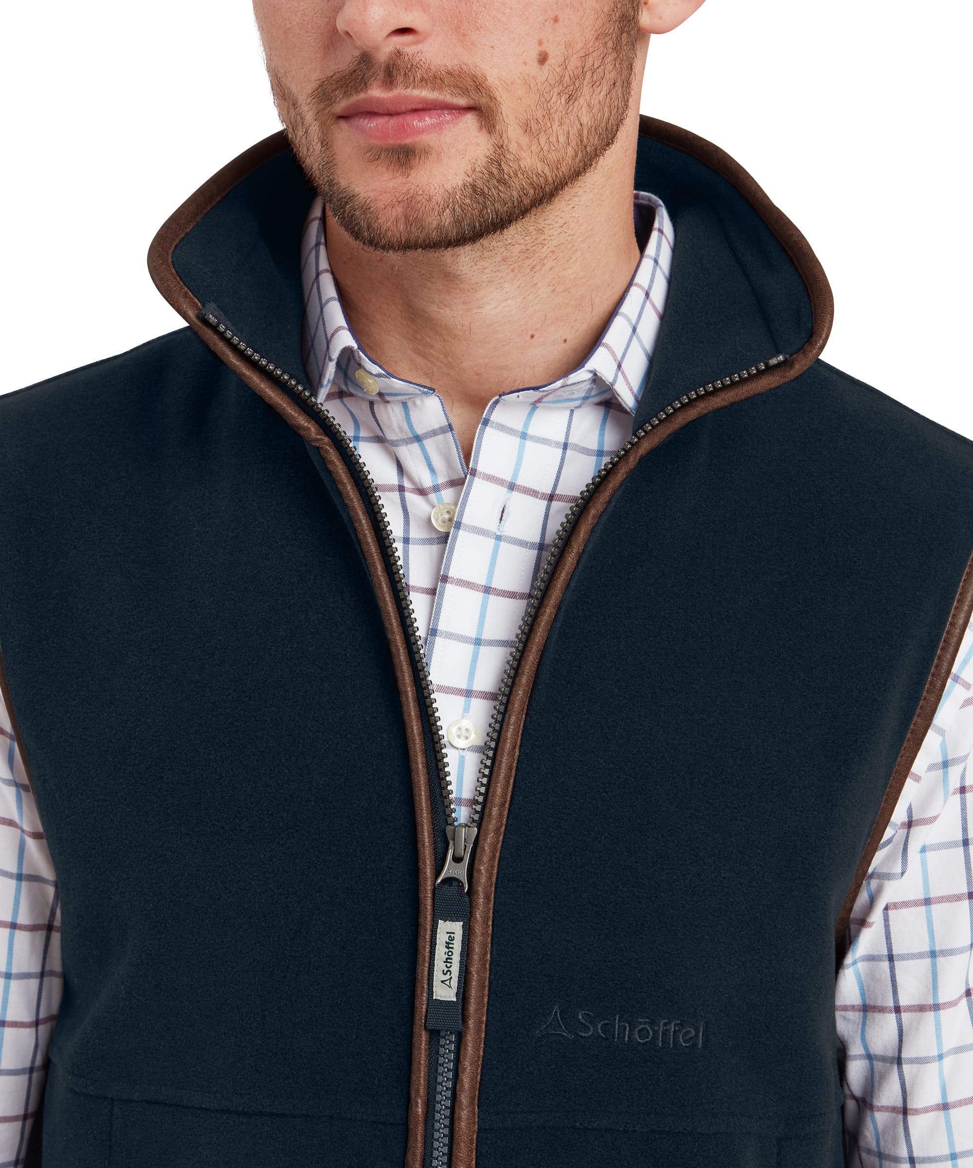 Man wearing a petrol blue gilet over a shirt with a white background