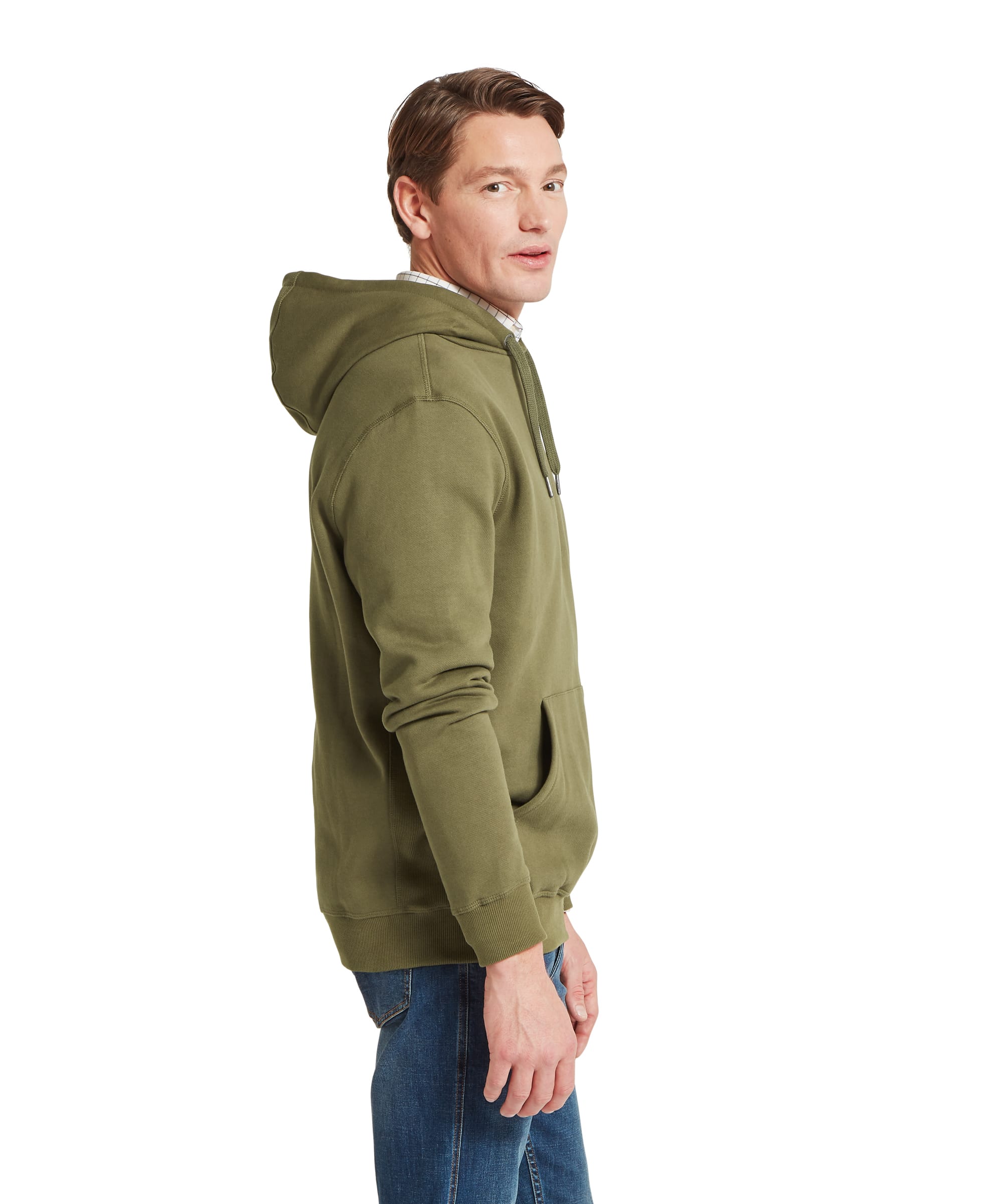 Schoffel Mens Pentire Heritage Hoodie in olive green, side view showing drawstring hood, kangaroo front pocket and relaxed heavy cotton construction, layered over a check shirt with blue jeans