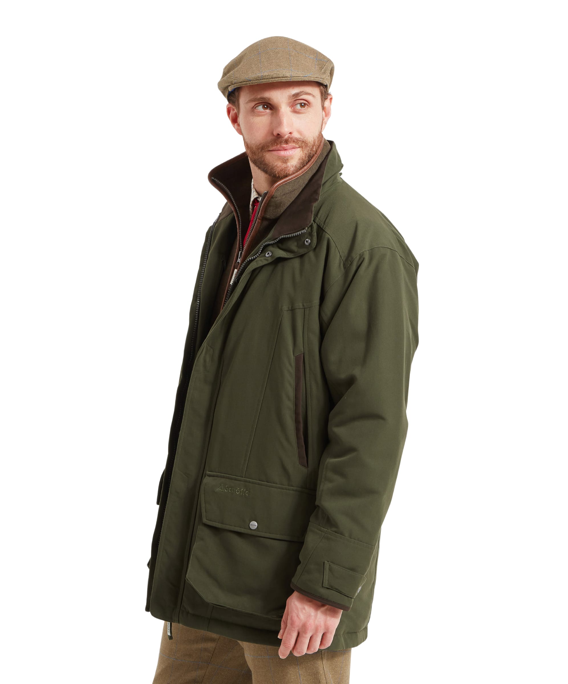 Schöffel Men's Ptarmigan Classic Coat in dark olive green — rear view showing clean back panel, storm collar and articulated sleeves with press-stud cuff adjusters, worn with tweed trousers and a tweed flat cap