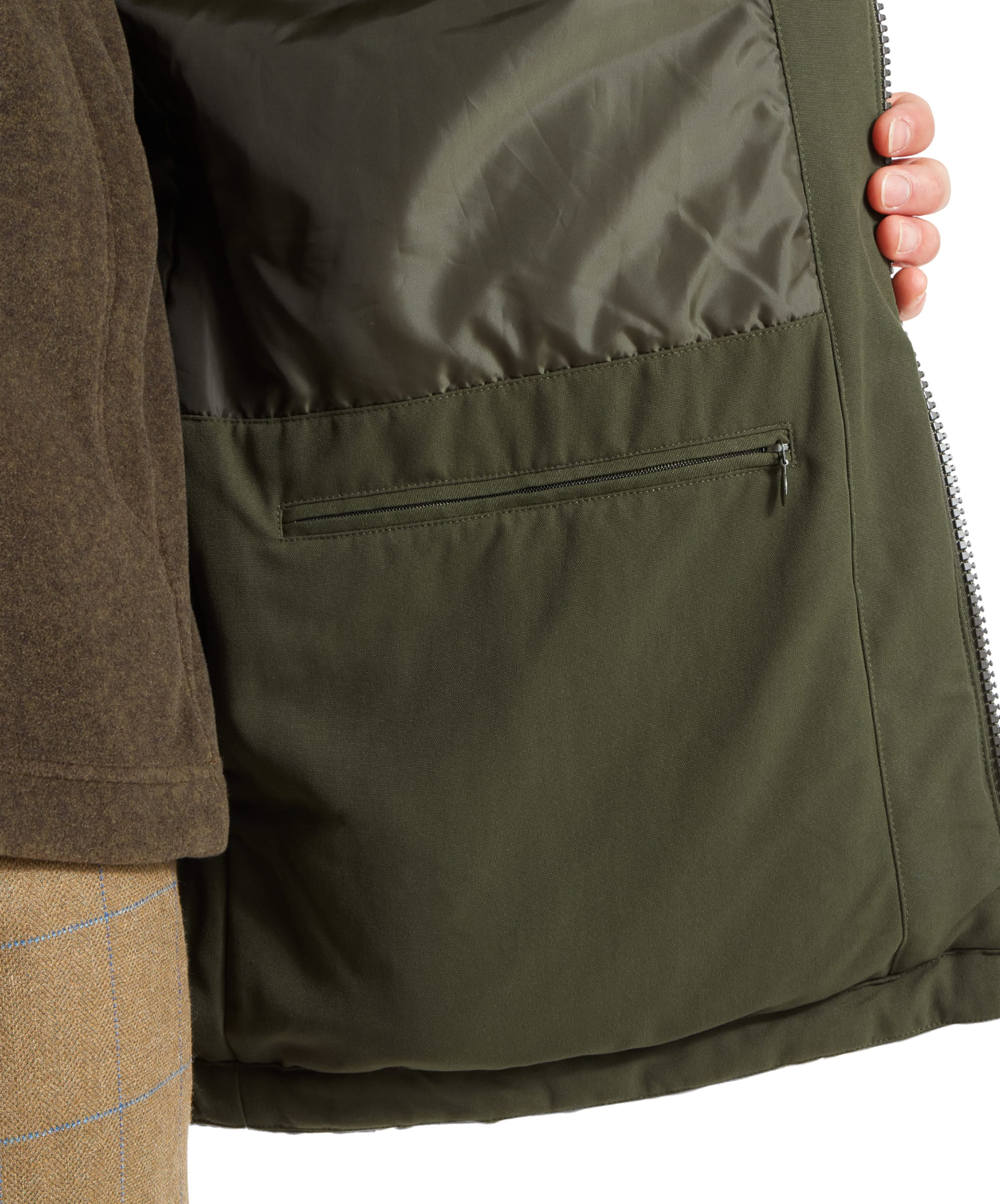 Schöffel Men's Ptarmigan Classic Coat in dark olive green — interior detail showing the large zipped security pocket and quilted lining, with the coat held open to reveal the full internal storage system
