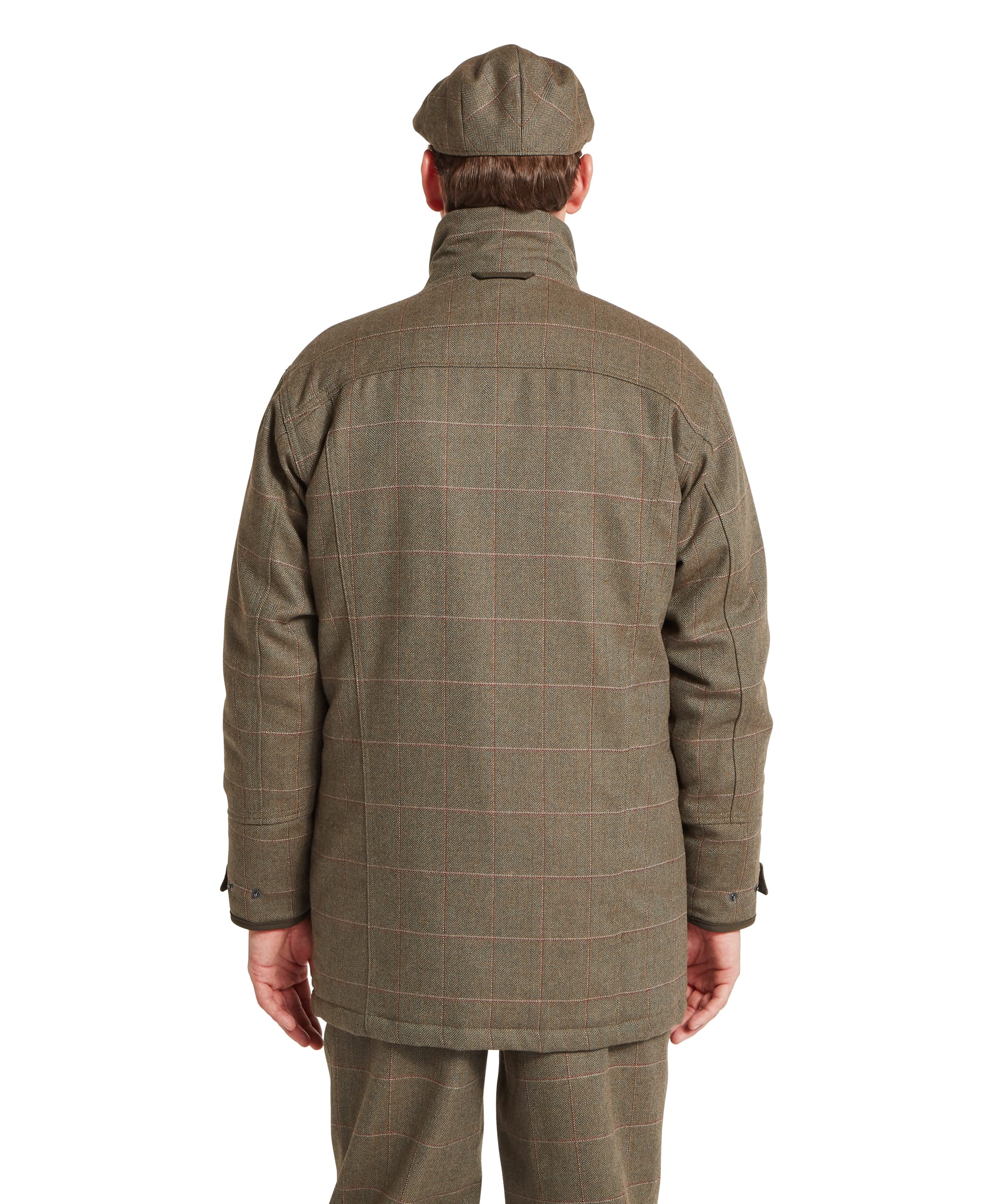 Schöffel Men's Ptarmigan Tweed Classic Coat in brown windowpane check tweed — rear view showing the full back panel in classic British tweed with red and buff overcheck, storm collar and articulated sleeves with press-stud cuff adjusters, worn with matching tweed trousers and a tweed flat cap