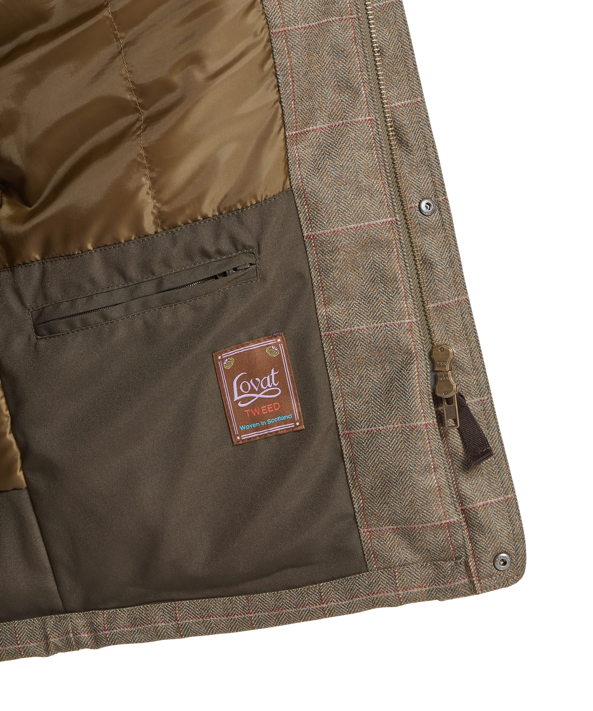 Schöffel Men's Ptarmigan Tweed Classic Coat in Lovat brown windowpane check — close-up detail of the internal zip-through front showing the Schöffel zipper pull, bronze-toothed zip and lining glimpse, coat held open by hand