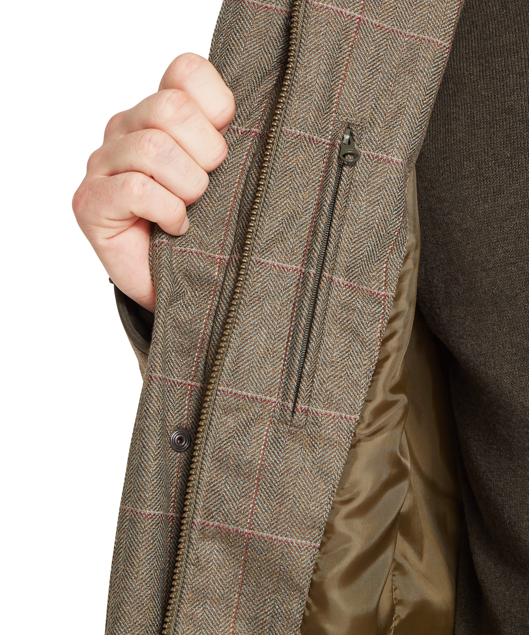 Schöffel Men's Ptarmigan Tweed Classic Coat in Lovat brown windowpane check — close-up of the press-stud cuff adjuster with olive grosgrain strap, Schöffel embroidered chest branding and lower pocket press-stud on the Lochlane tweed fabric