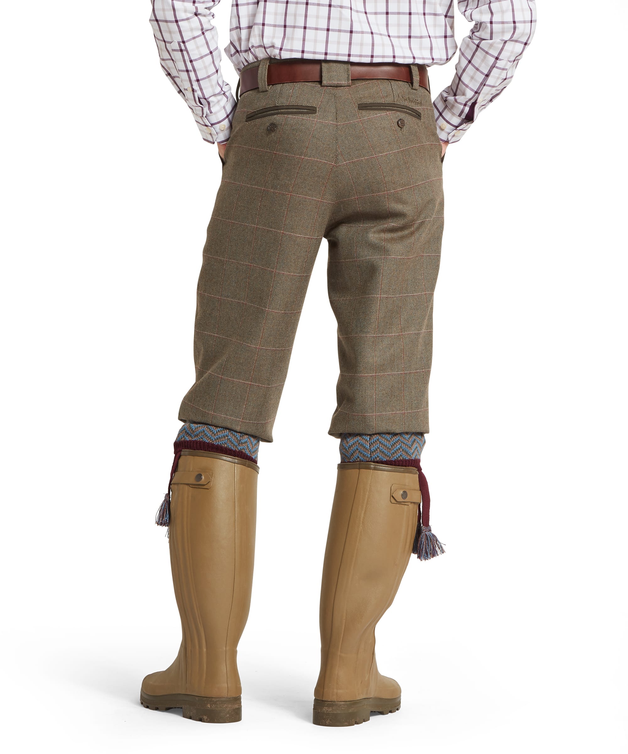 Schöffel Men's Ptarmigan Tweed Plus Twos in Lovat brown Lochlane windowpane check — rear view showing back pockets with zip welt trim, Schöffel embroidered logo and clean tailored seat, worn with Le Chameau wellington boots and patterned sock garters