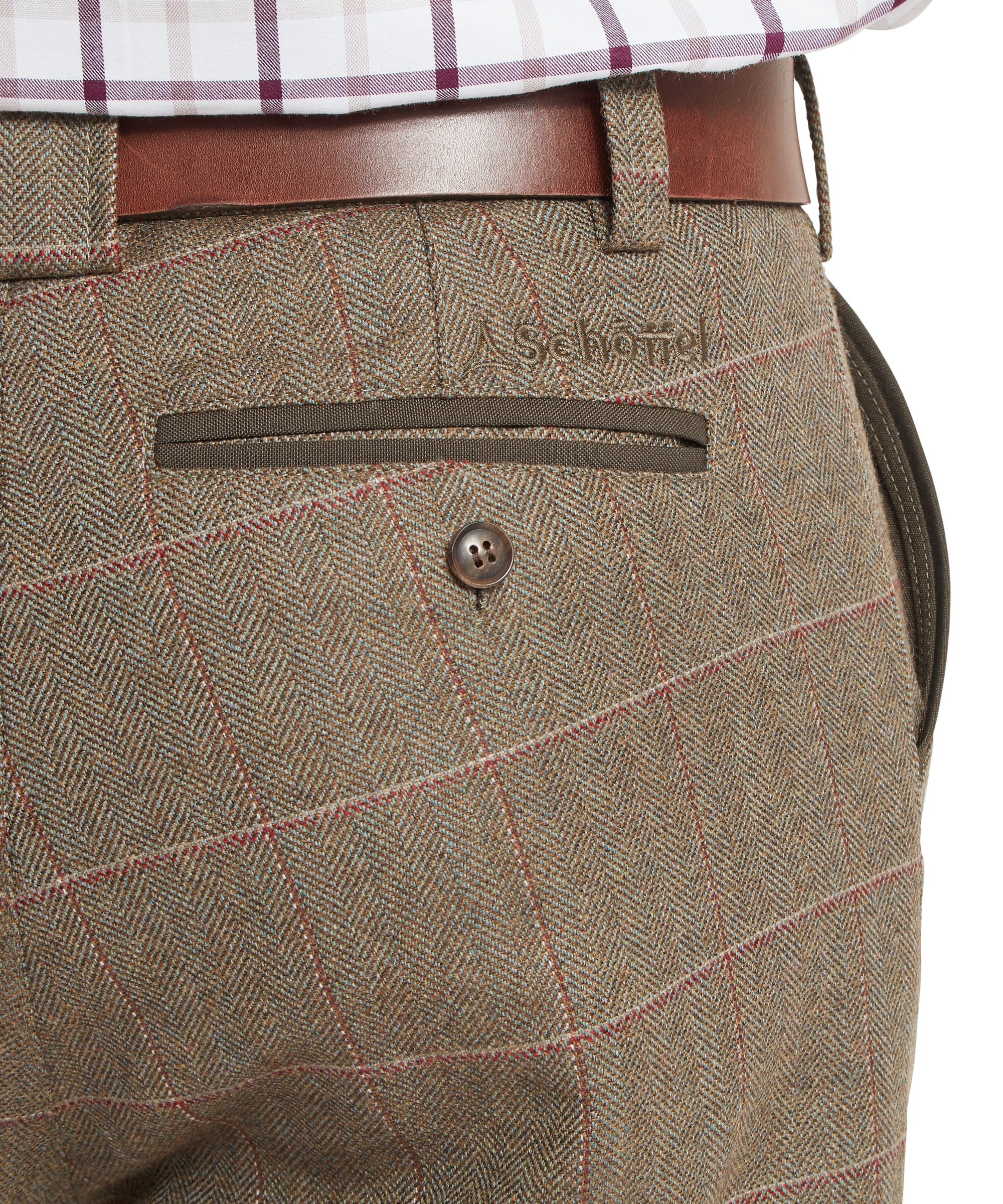 Schöffel Men's Ptarmigan Tweed Plus Twos in Lovat brown Lochlane windowpane check — close-up rear detail showing embroidered Schöffel logo at the waistband, zip welt back pocket with brown trim and classic tweed herringbone weave with red and buff overcheck