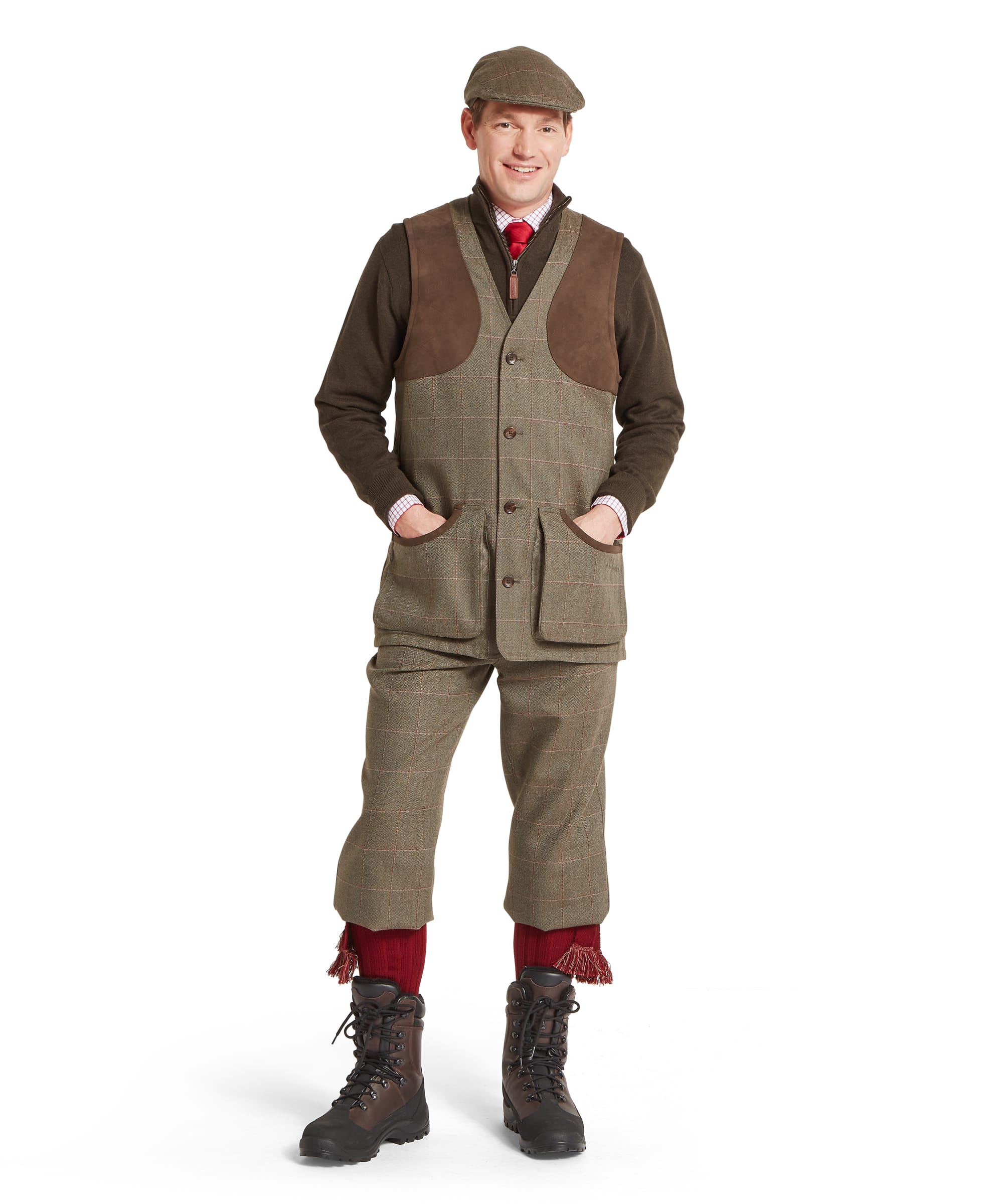 Schöffel Men's Ptarmigan Tweed Waistcoat II in Lovat brown windowpane check — rear view showing clean tweed back panel with back-cinch belt adjustment, worn over a dark brown zip-neck gilet with matching tweed plus twos and flat cap