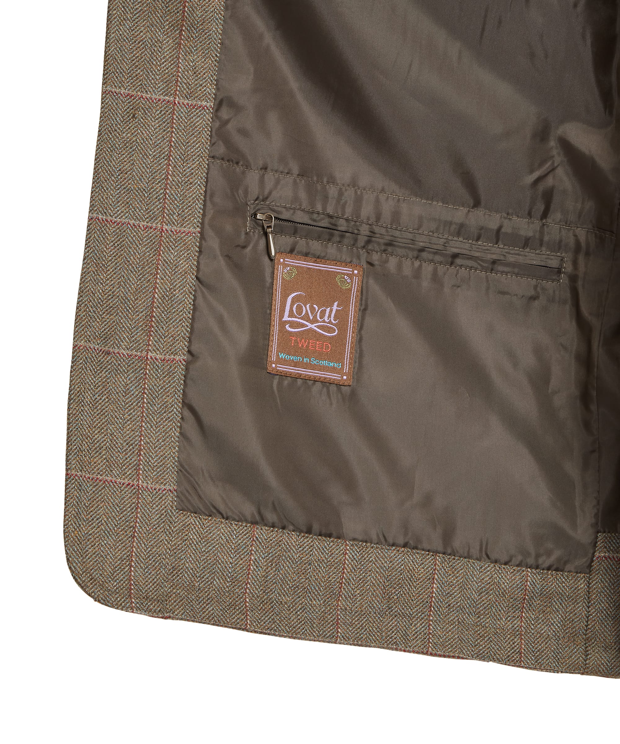 Schöffel Men's Ptarmigan Tweed Waistcoat II in Lovat brown windowpane check — interior detail showing the zipped internal security pocket and brown satin lining, coat held open to reveal the Lovat Tweed "Woven in Scotland" woven label