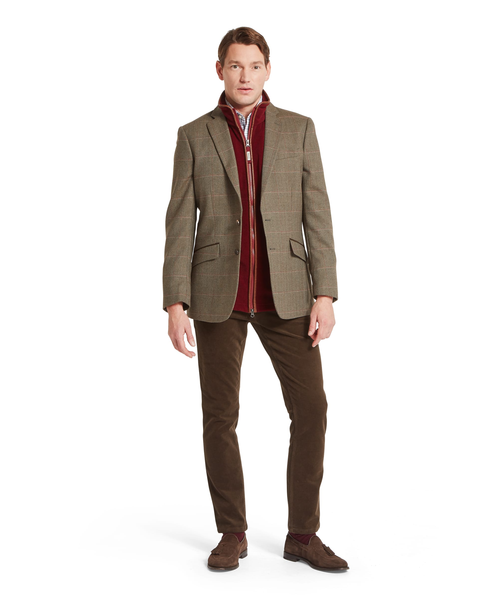 Schöffel Men's St Andrews Tweed Sports Jacket in Lovat brown Lochlane windowpane check — rear view showing clean single-vent back, notched collar and two-button silhouette in classic Lovat Tweed woven in Scotland, layered over a burgundy zip-neck gilet and worn with brown corduroy trousers