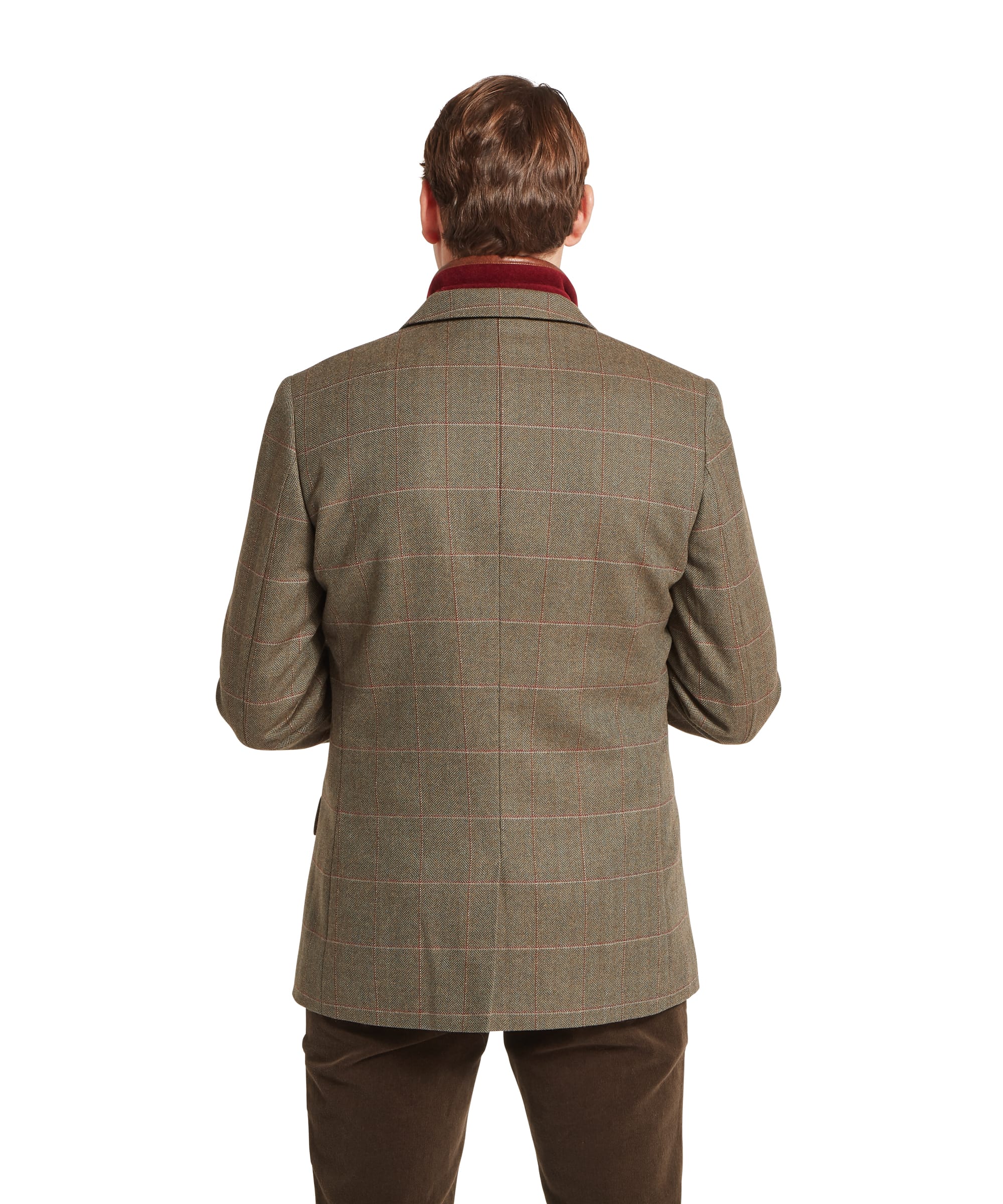 Schöffel Men's St Andrews Tweed Sports Jacket in Lovat brown Lochlane windowpane check — close-up of the lower pocket with hand inside the brown suede-bound jetted pocket opening, three-button cuffs visible and red and buff overcheck fabric shown in detail