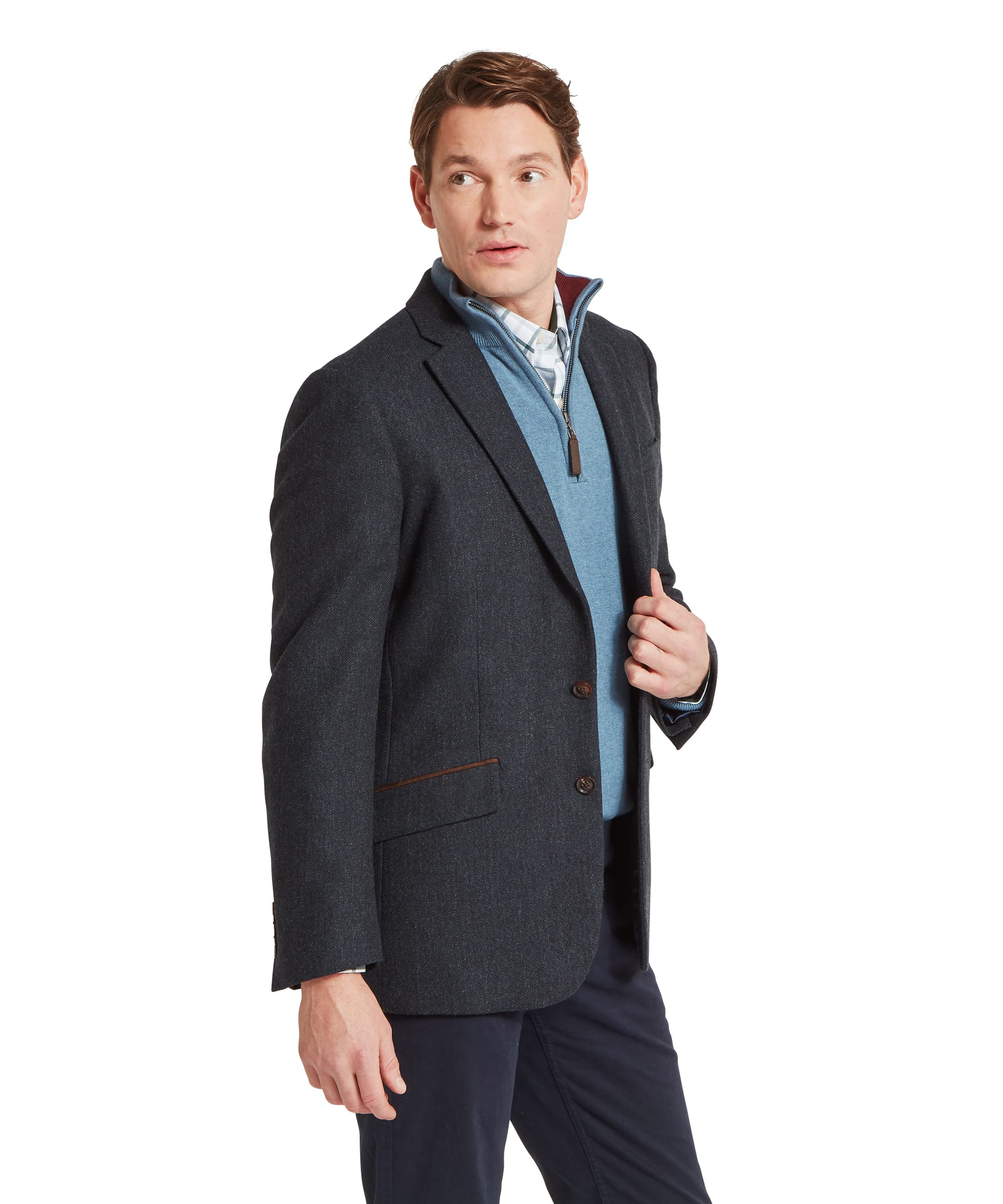 Schöffel Men's St Andrews Tweed Sports Jacket in navy herringbone — rear view showing single-vent back, clean silhouette in dark navy Lovat Tweed and three-button cuffs, layered over a light blue zip-neck gilet, worn with navy trousers