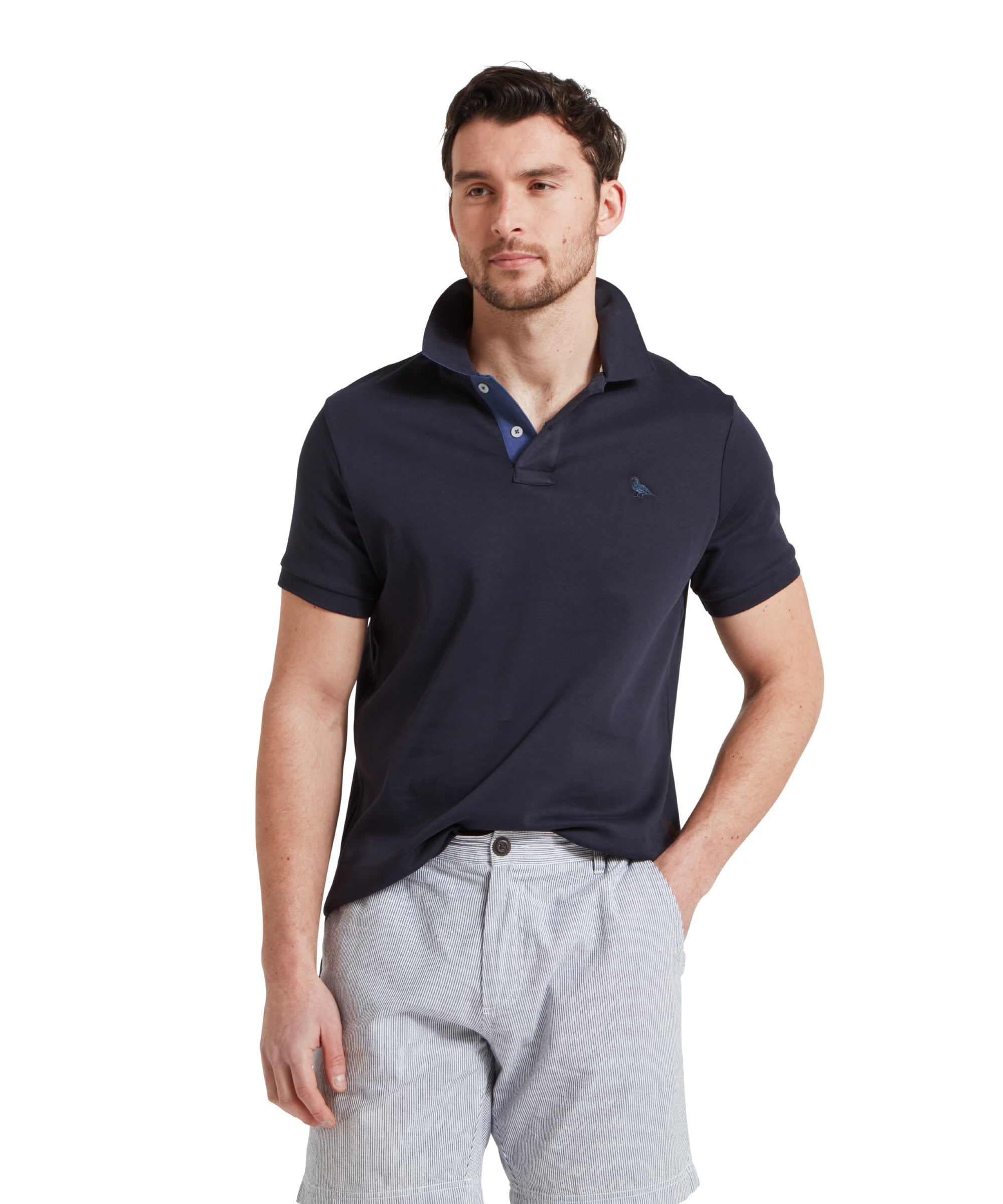 Schöffel Men's St Ives Jersey Polo Shirt in navy, worn by model styled with striped shorts, contrast blue placket trim