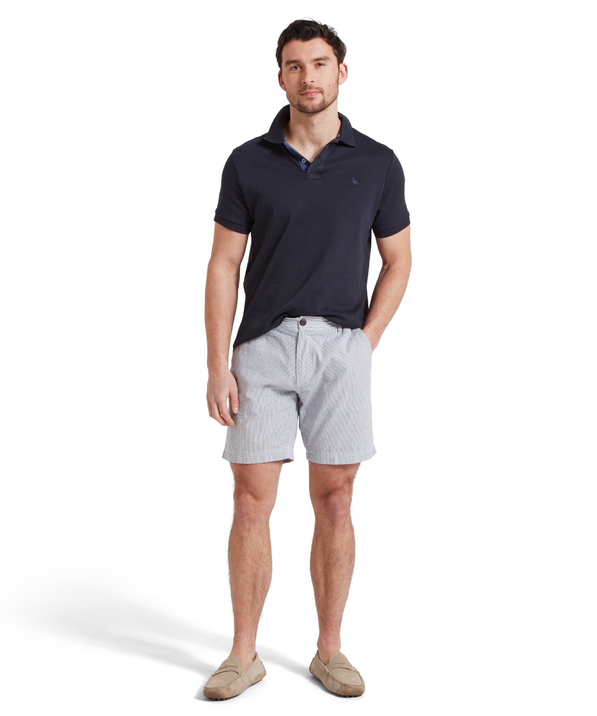 Schöffel Men's St Ives Jersey Polo Shirt in navy, full-length view on model styled with striped shorts and suede loafers