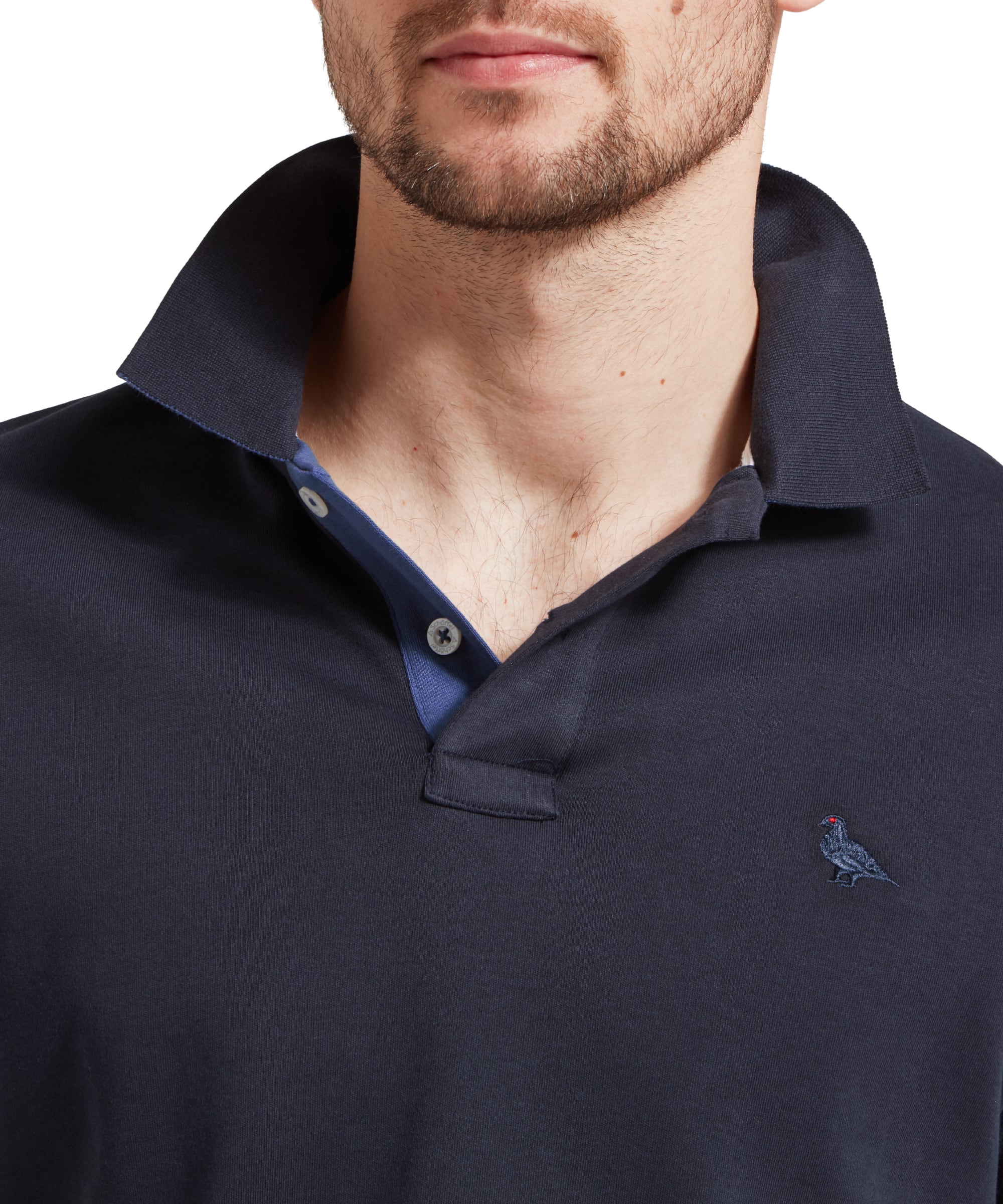 Schöffel Men's St Ives Jersey Polo Shirt in navy, close-up collar detail on model showing contrast blue placket trim
