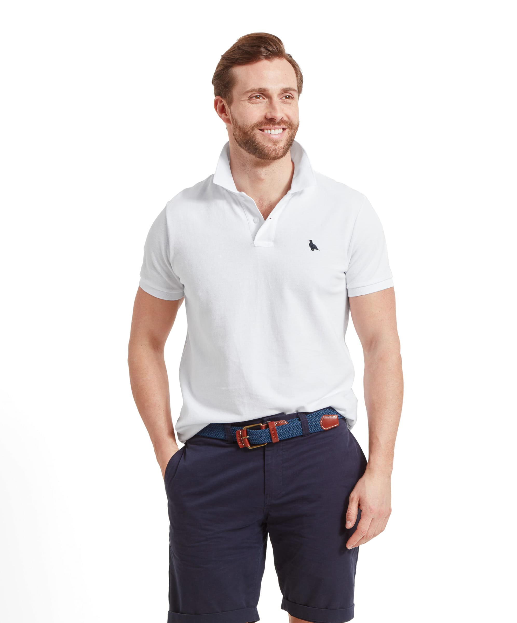 Schöffel Men's St Ives Polo Shirt in white, worn by model styled with navy shorts and woven belt
