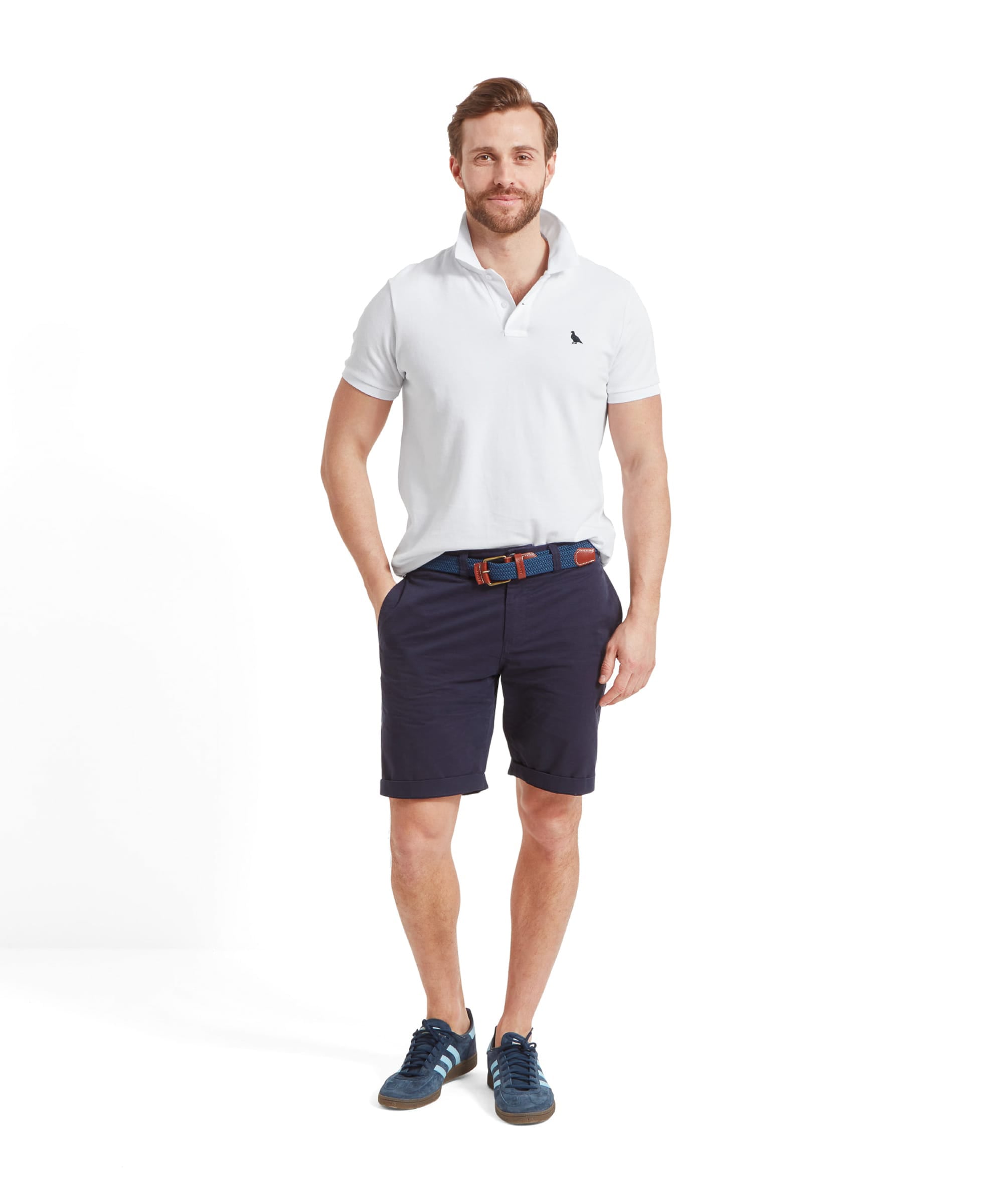 Schöffel Men's St Ives Polo Shirt in white, full-length view on model paired with navy shorts and suede trainers