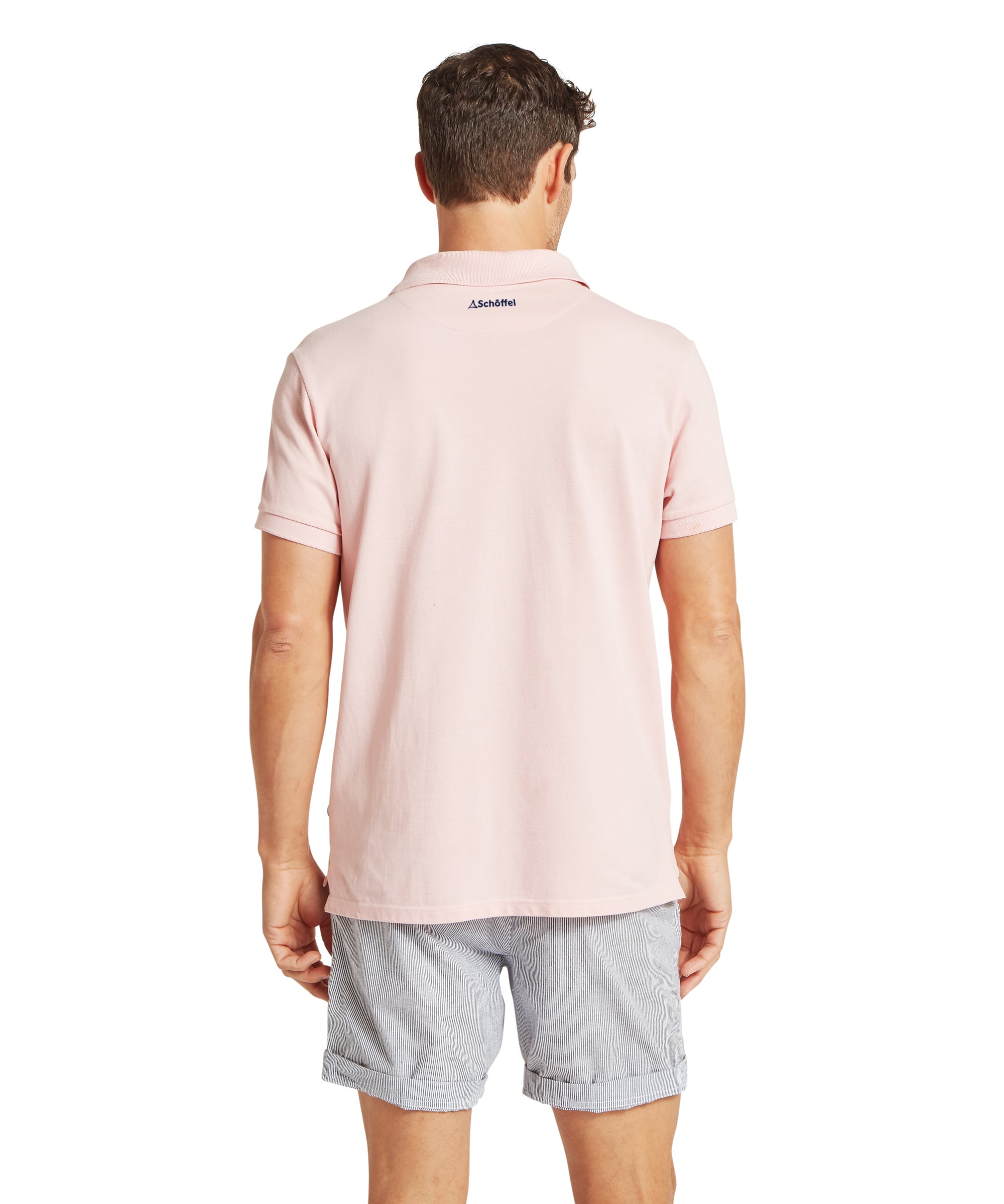 Schöffel Men's St Ives Polo Shirt in pale pink, back view on model showing Schöffel neck branding, styled with striped shorts