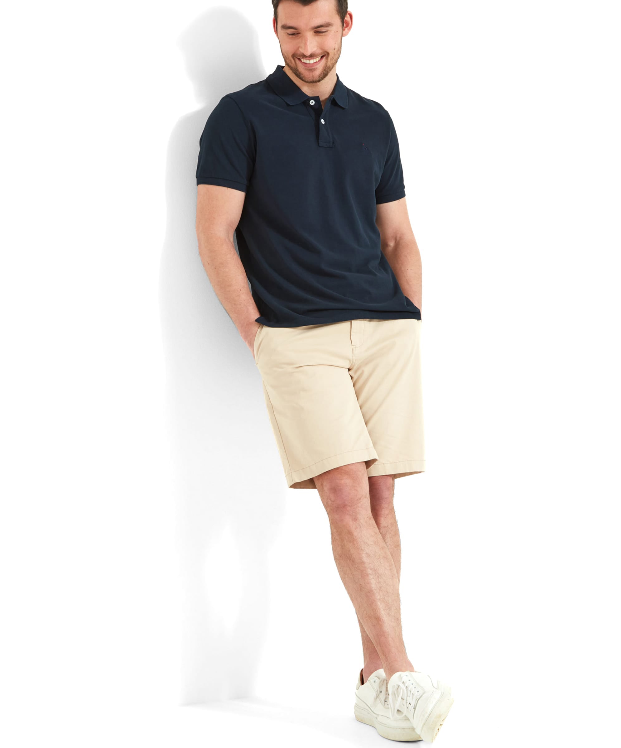 Schöffel Men's St Ives Polo Shirt in navy, full-length view on model styled with beige shorts and white trainers