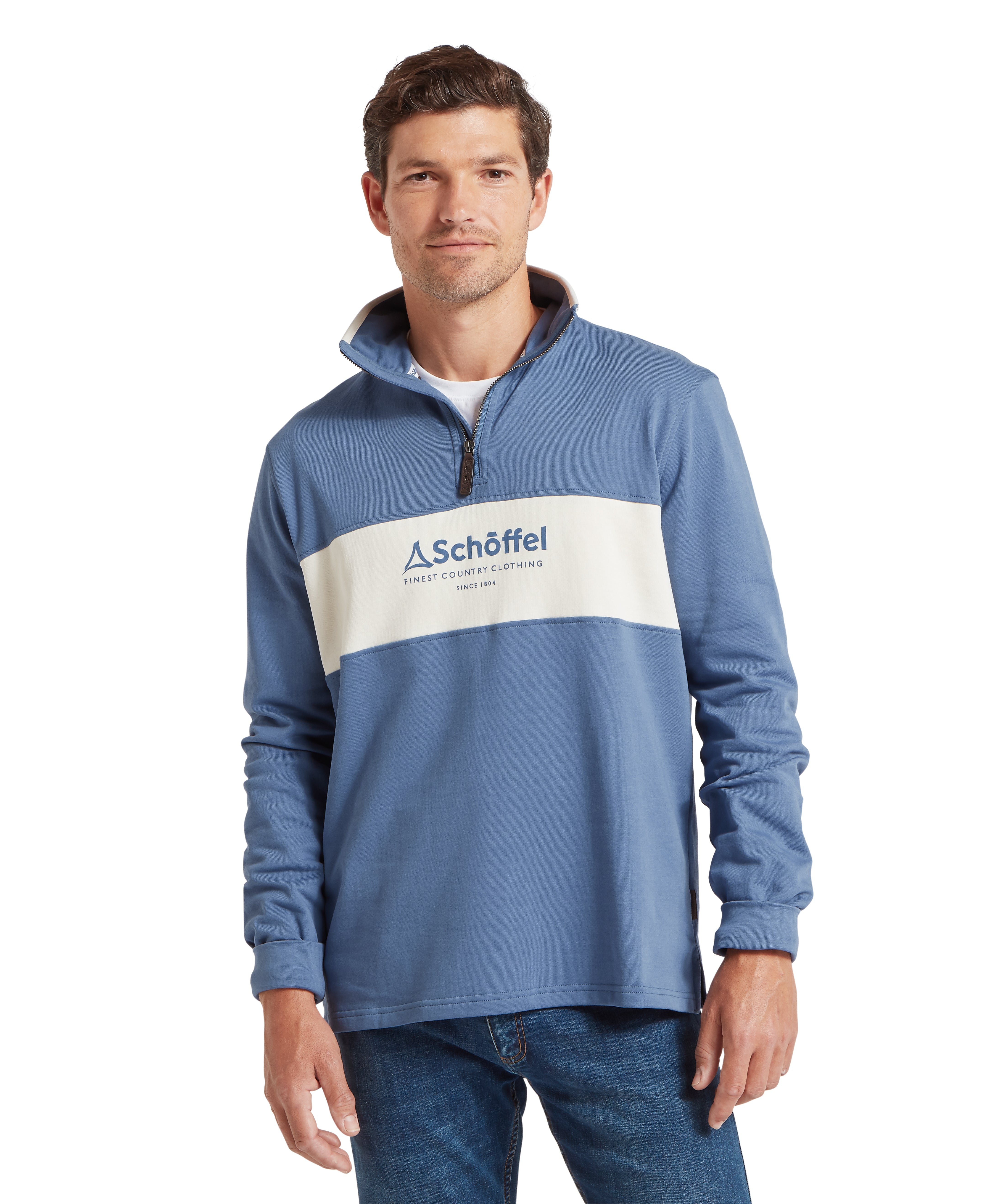 Man wearing a blue and white sweatshirt with a Schöffel logo against a white background