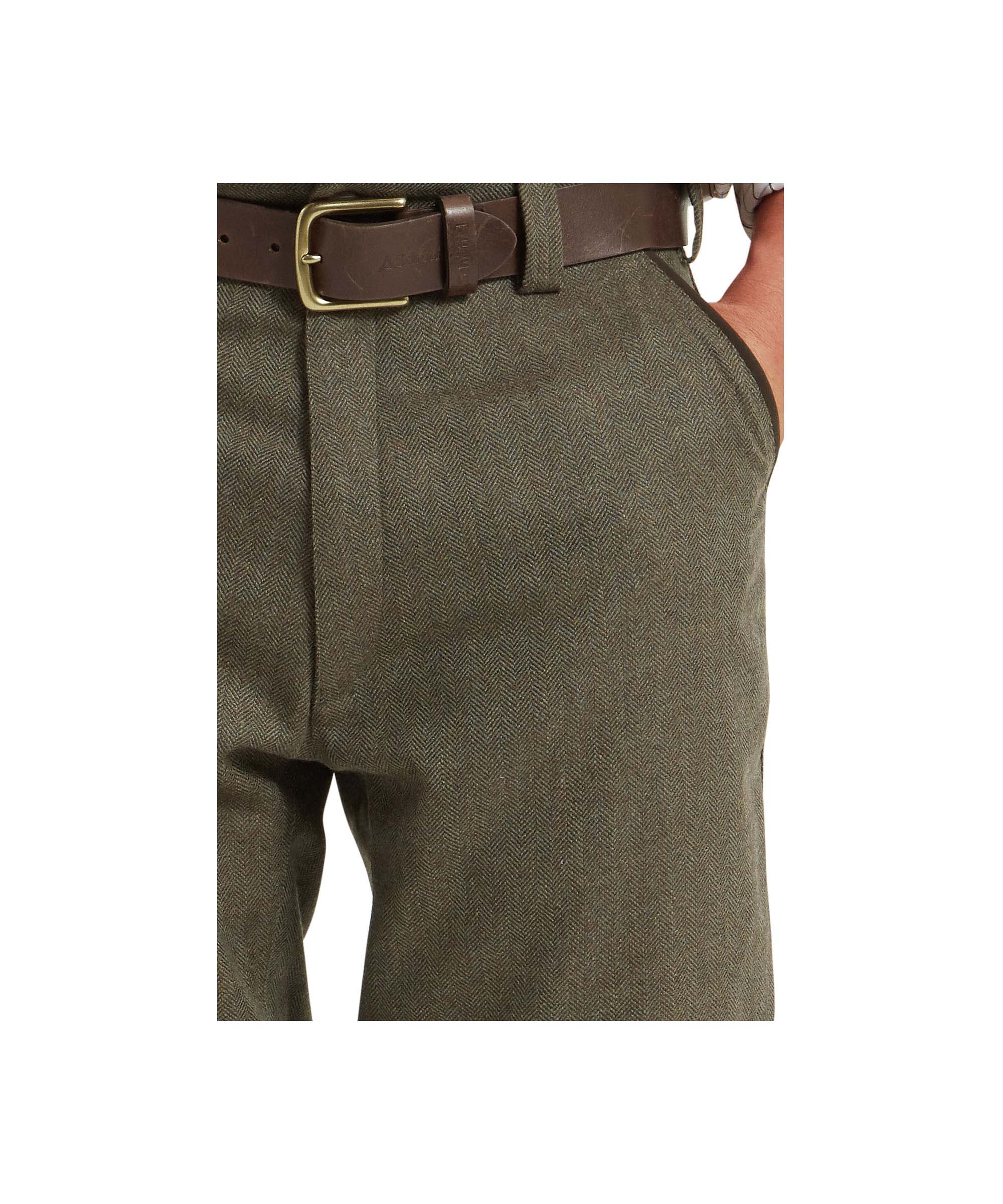 Schöffel Men's Tweed Plus Twos in Green herringbone tweed worn by male model, front view showing leather belt and waistband detail