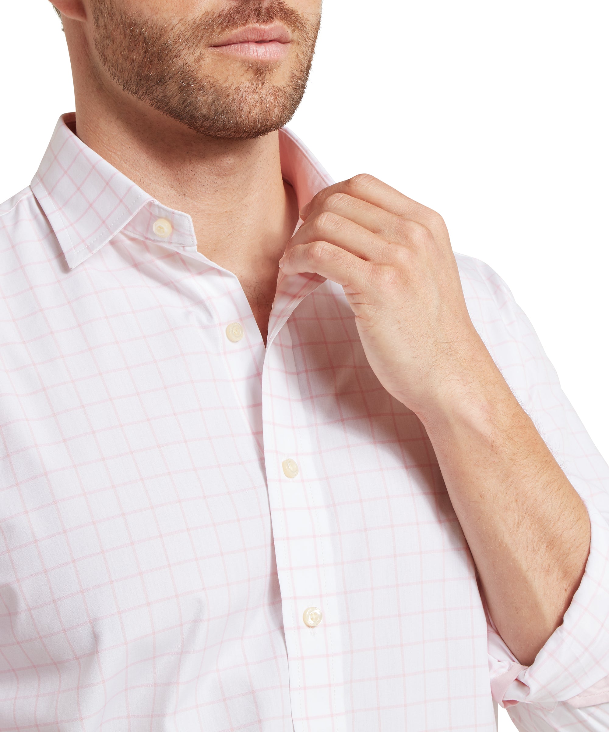 Man wearing a light pink checkered shirt with rolled-up sleeves on a white background