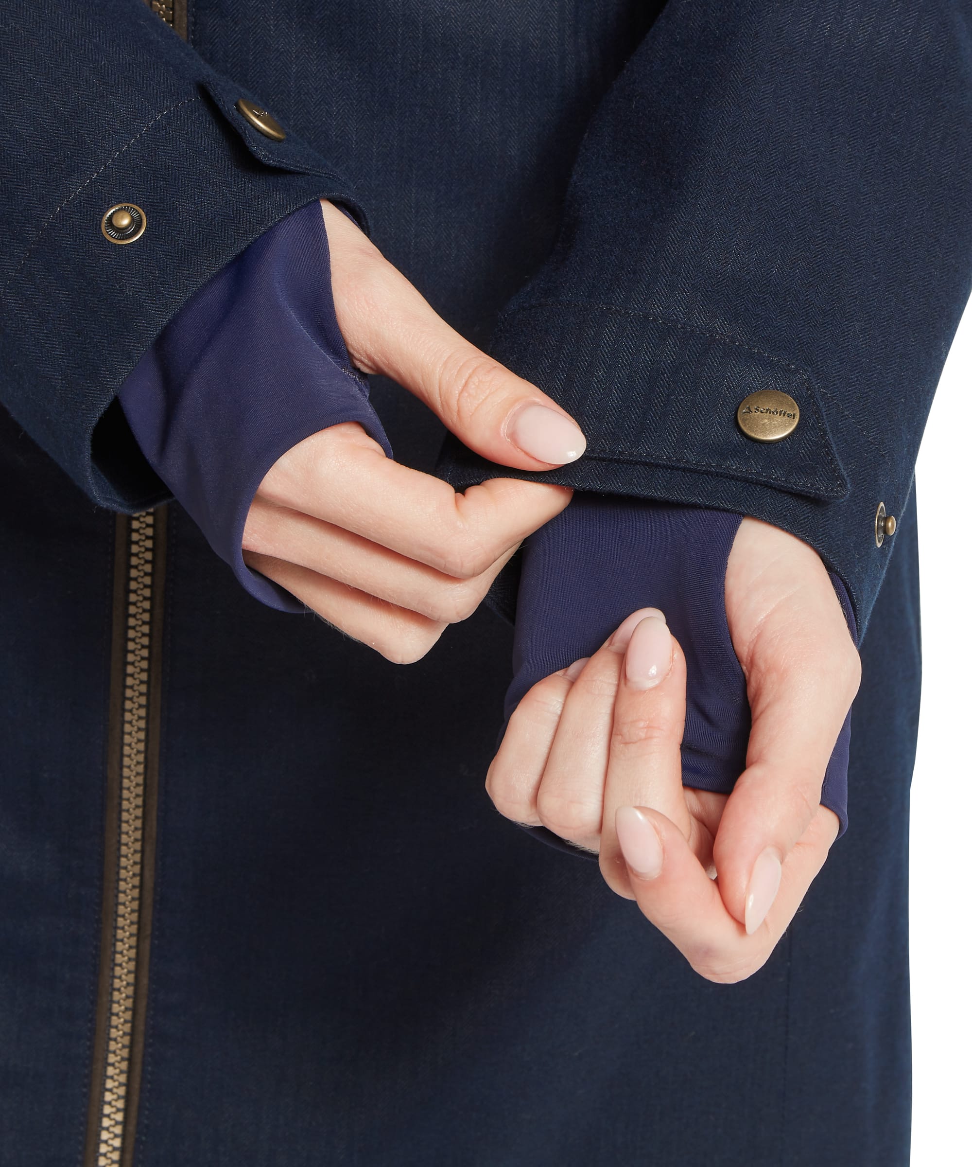 Detailed view of the adjustable snap-fastened cuffs on the Women's Allexton Waterproof Coat in Navy, highlighting the Schöffel branded button and bronze hardware against the herringbone outer fabric