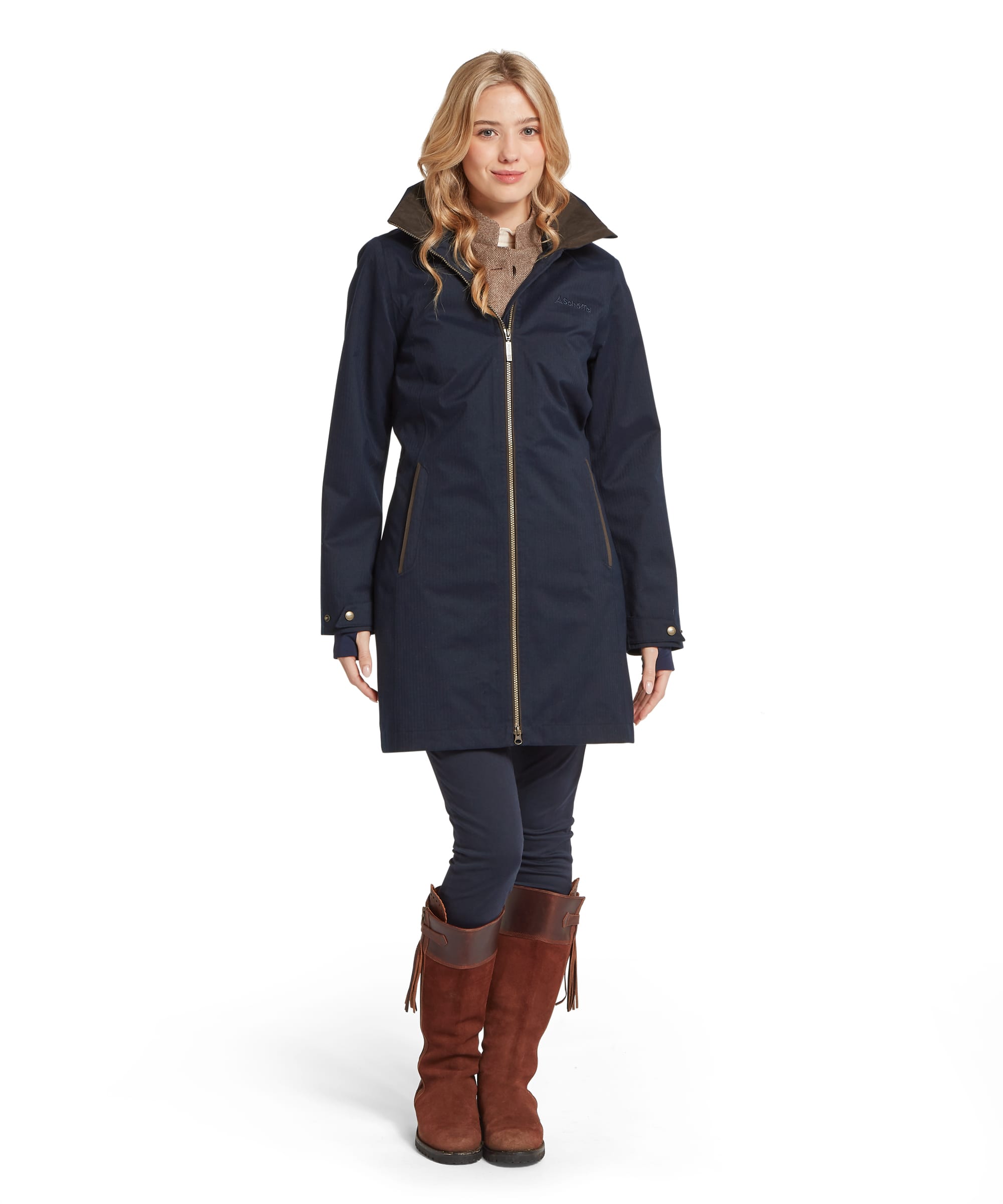Schöffel Women's Allexton Waterproof Coat in navy, full-length front view with hood up, showing the relaxed longline fit, gold-tone zip and tan riding boots
