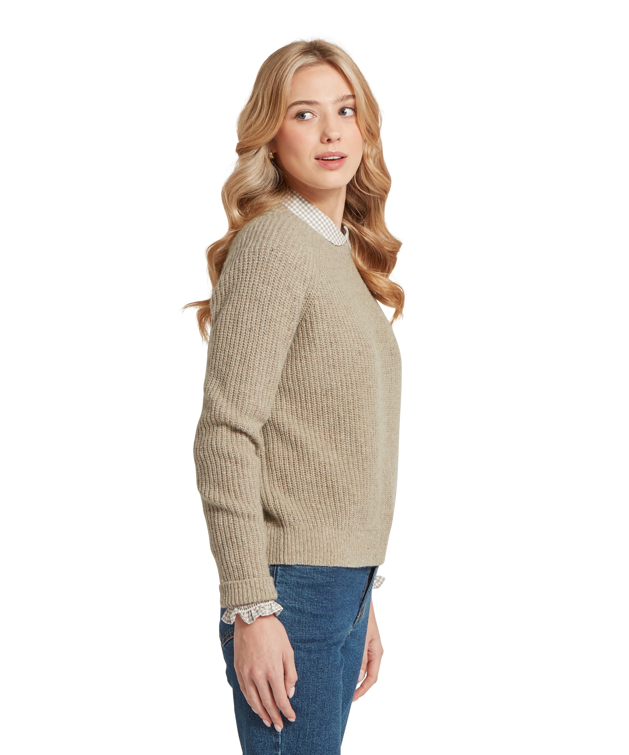Schöffel Women's Balmaha Jumper in oatmeal cream, side view of a relaxed ribbed-knit crew neck jumper with raglan sleeves and ribbed hem, styled over a grey gingham collared shirt with blue jeans