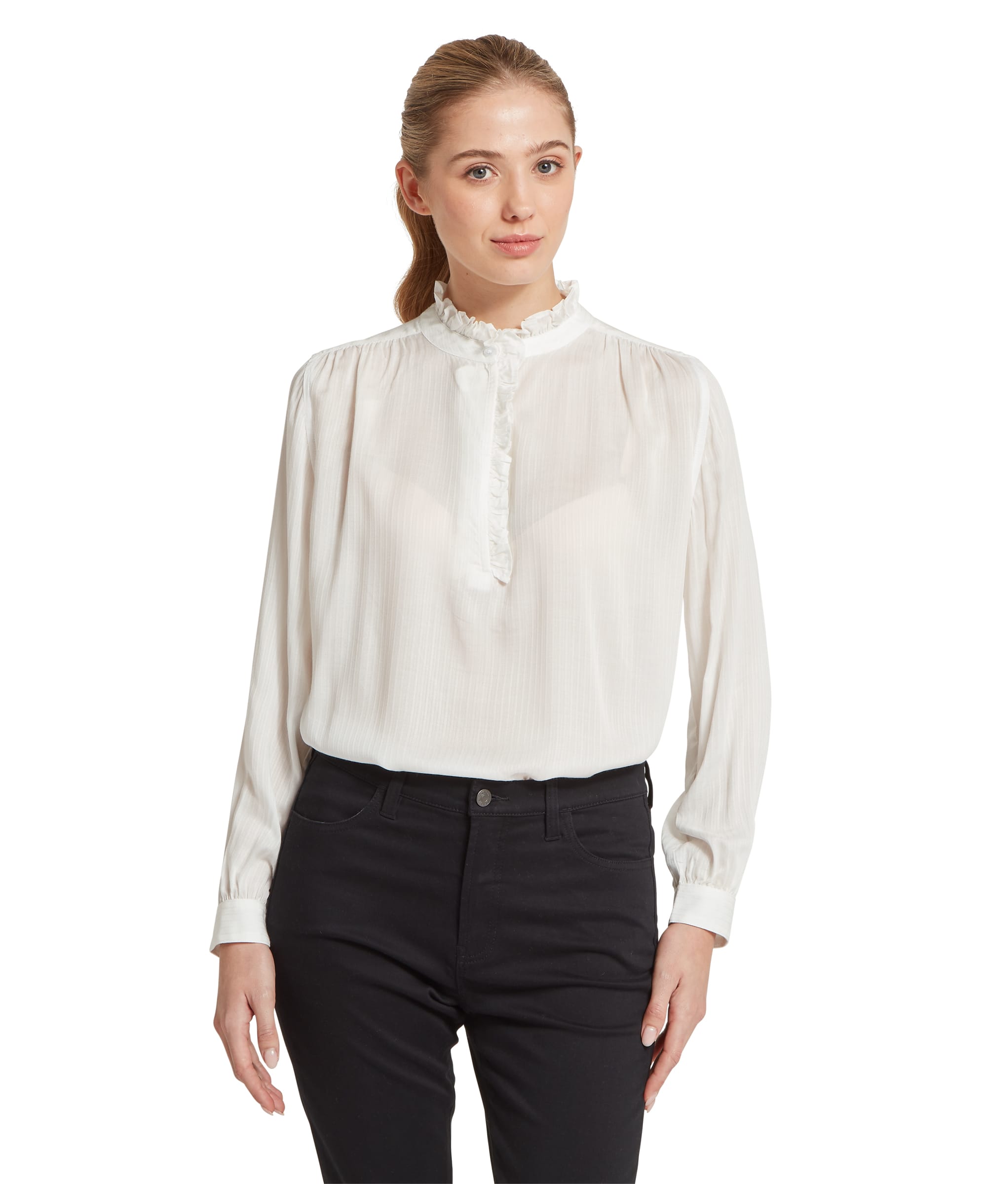 Schöffel Women's Chelsworth Blouse in white, front view showing the delicate ruffle-neck collar, ruffle placket with covered buttons, gathered shoulders and blouson long sleeves, worn with black slim trousers